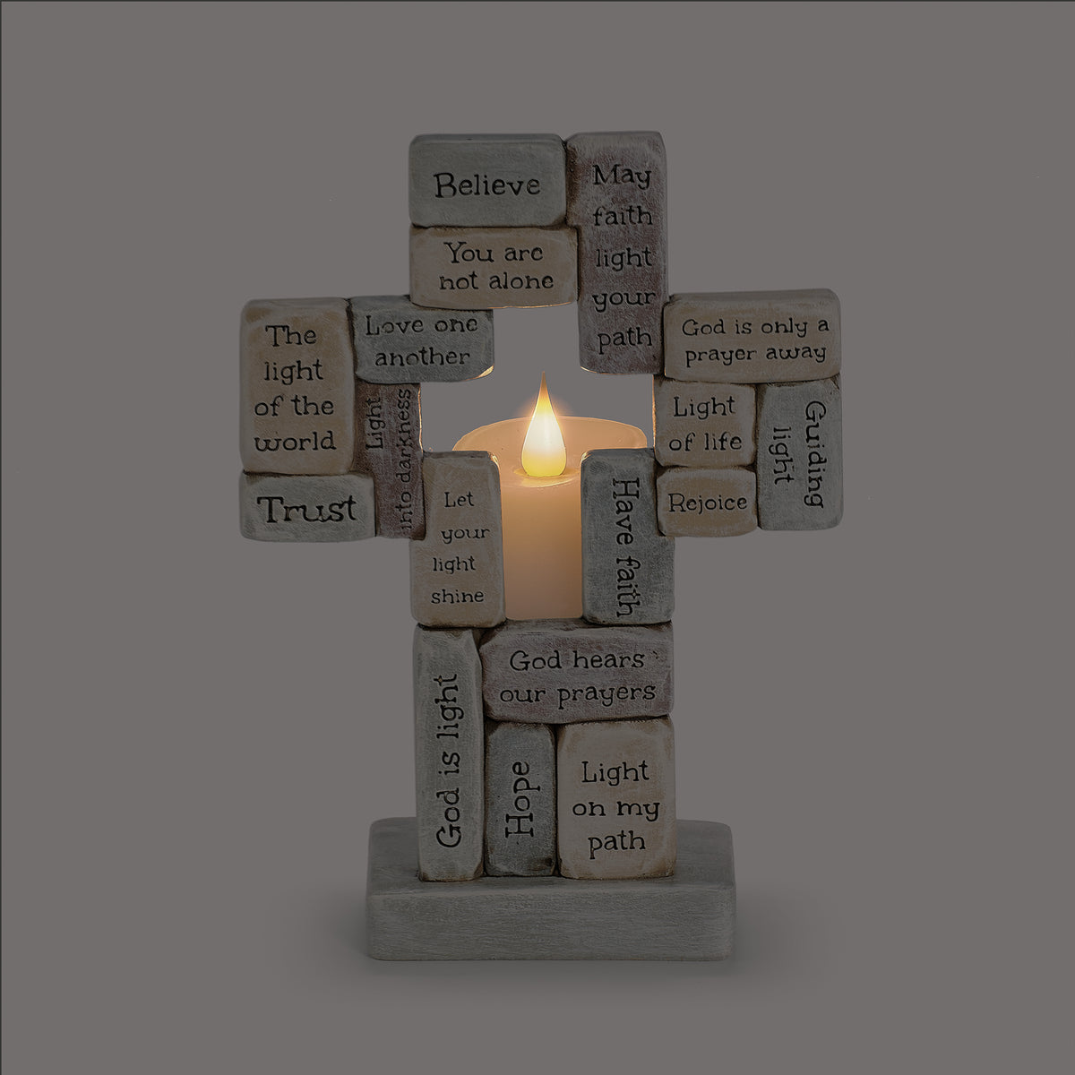 Crossword Cross Candle Holder illuminated with glowing candle