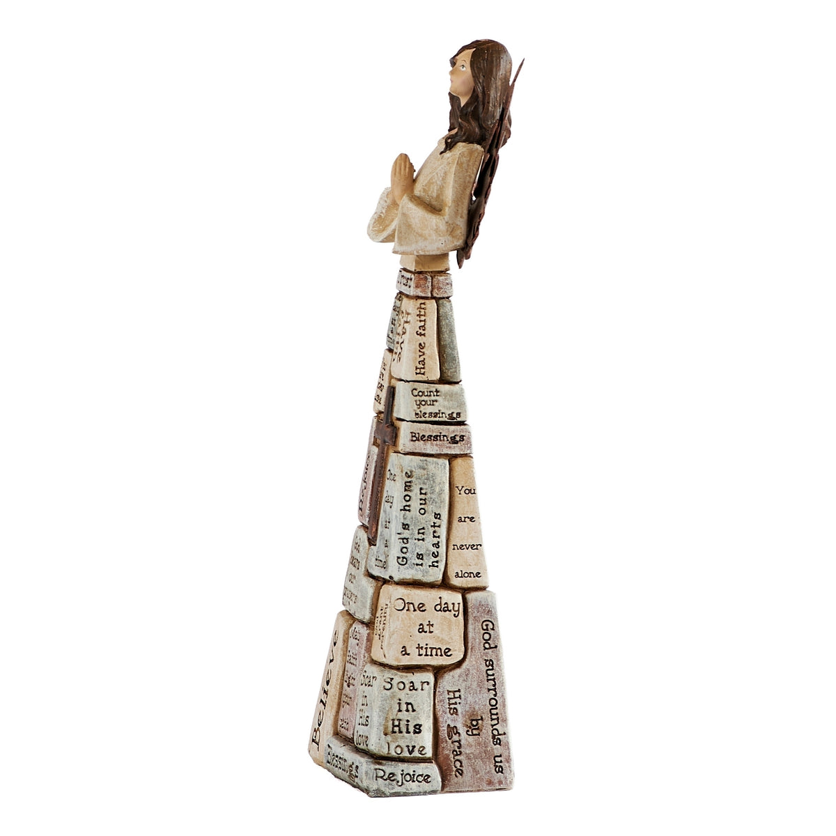 Side view of crossword angel showing clasped hands, flowing sleeves, and the patterned gown.