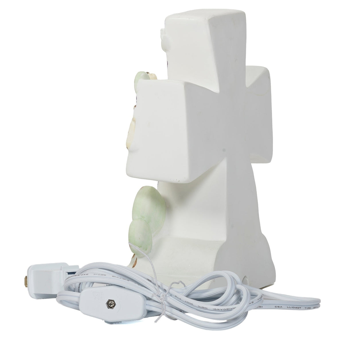 Back angled view of God Created Everything Children’s Night-Light showing the white cross-shaped body and attached power cord