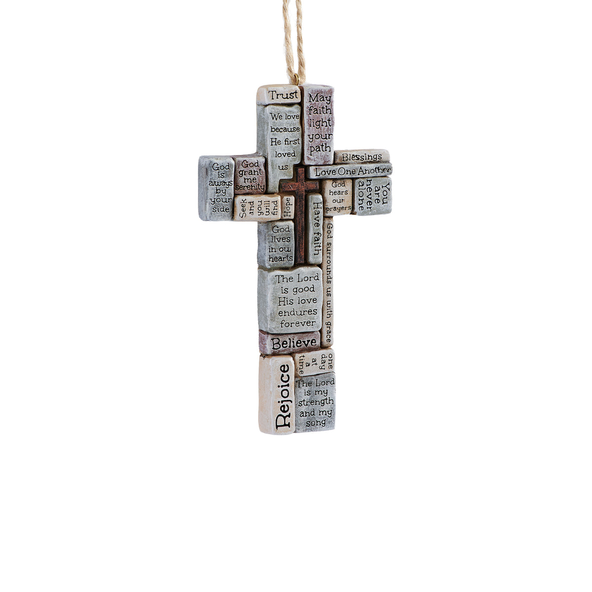 Cross ornament with a small bronze-toned cross surrounded by textured word blocks reading “Trust,” “Believe,” “Rejoice,” and other faith messages, hung from twine.