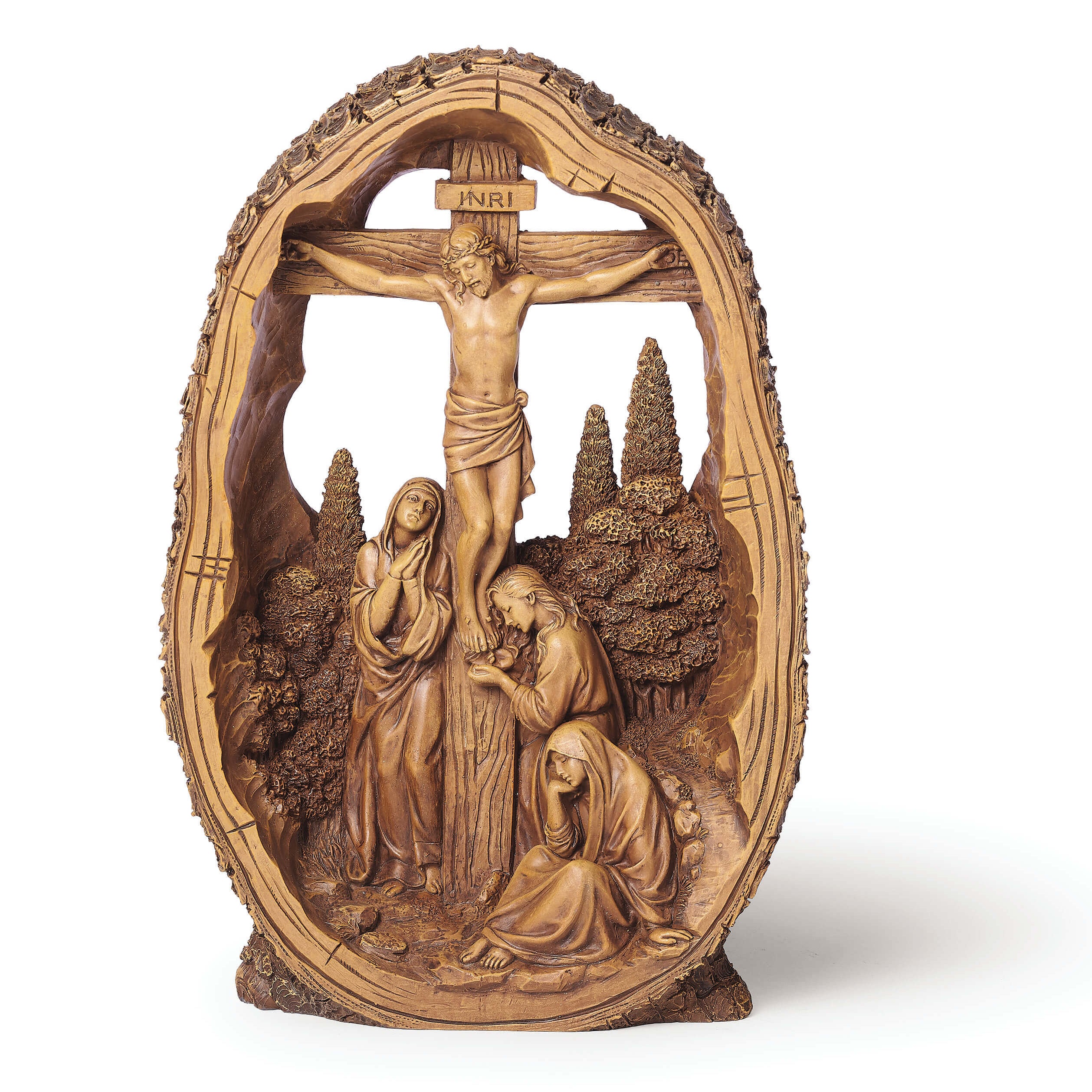 Wooden sculpture of the crucifixion scene with figures around it on a white background