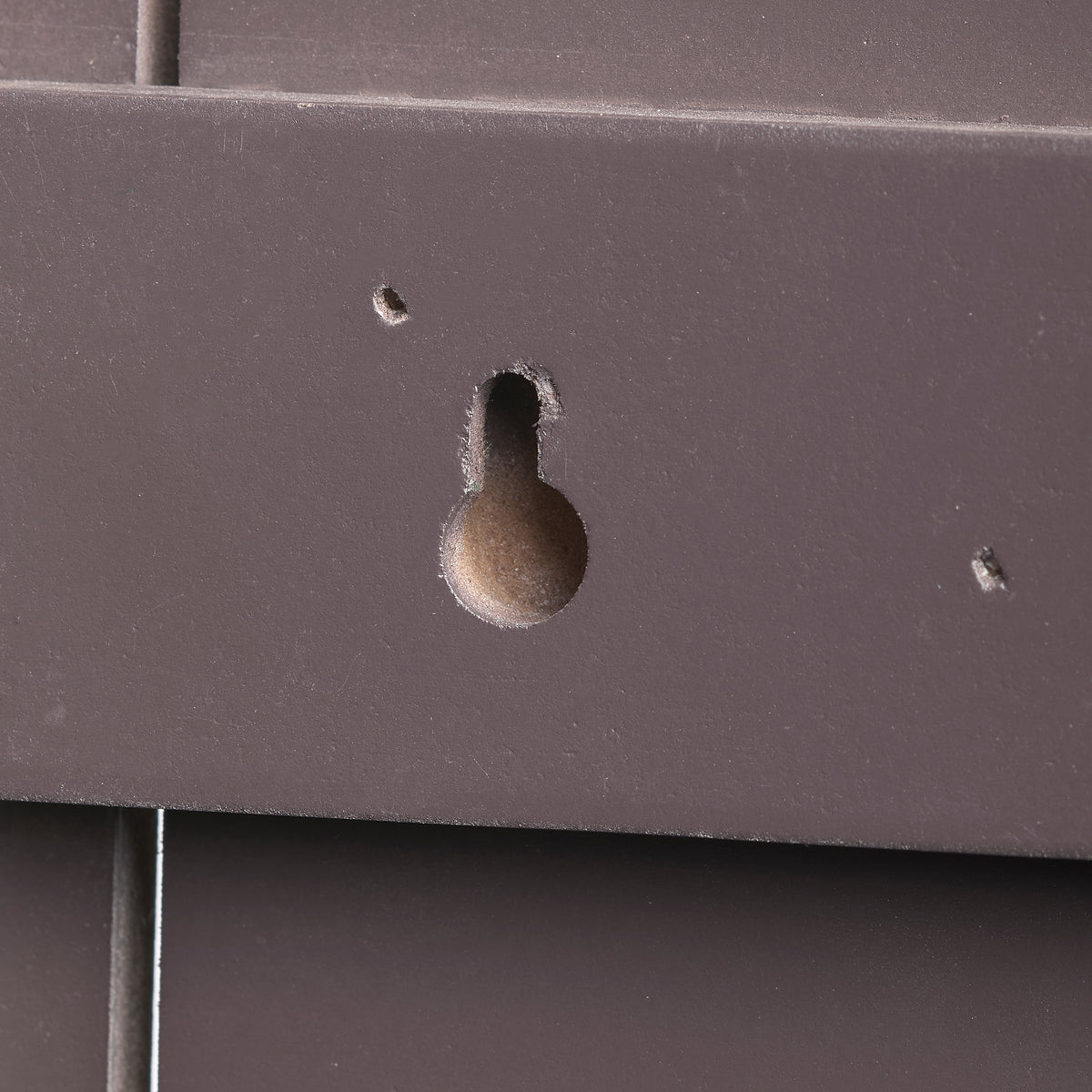 Close-up of the back of Joseph's Studio Holy Family Decorative Panel showing the keyhole-style wall hanging slot