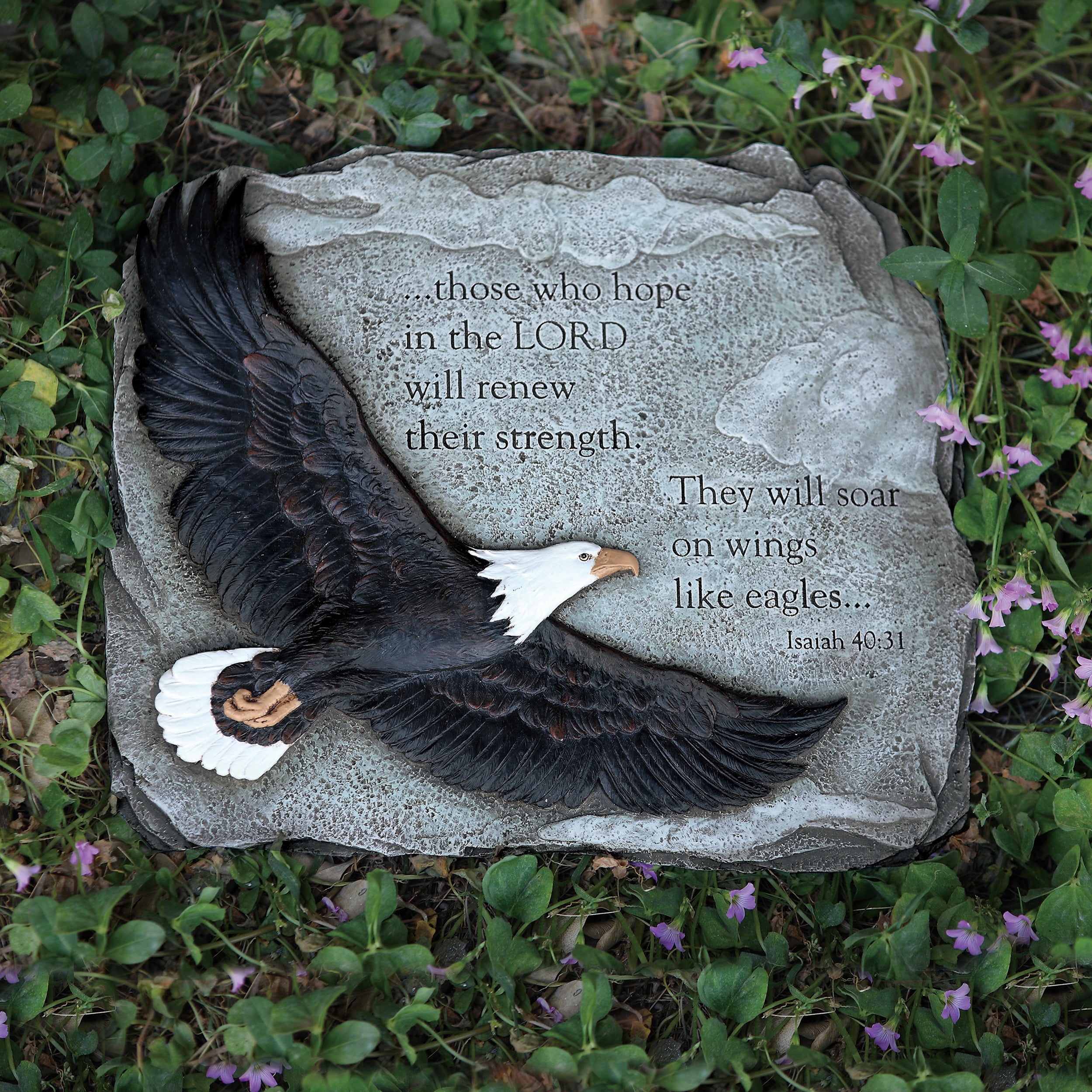 Decorative stone with an eagle sculpture and bible quote on a flower background