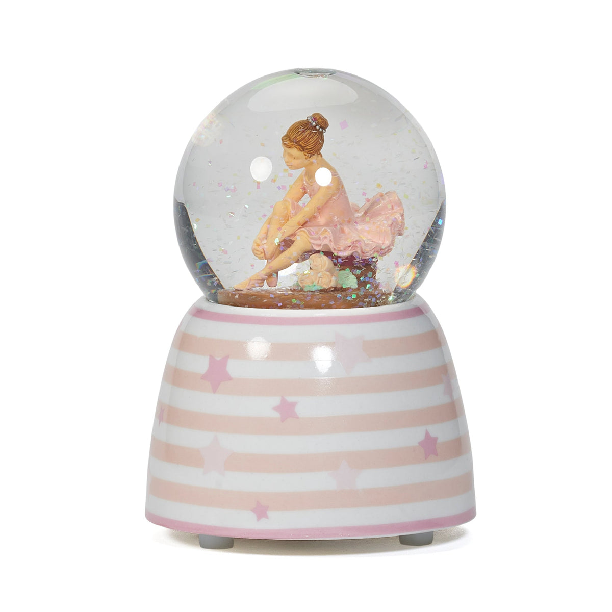 Side view of Glitterdome Musical Ballerina showing the seated dancer in her pink tutu inside the globe above the striped star base
