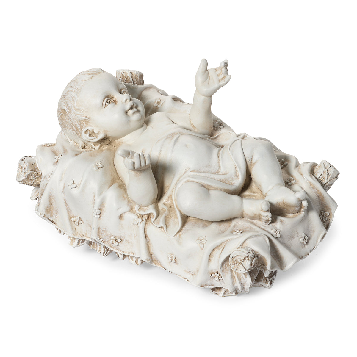 Side angled view of Joseph's Studio Baby Jesus Garden Figure showing the Christ Child lying peacefully in the textured manger with draped bedding