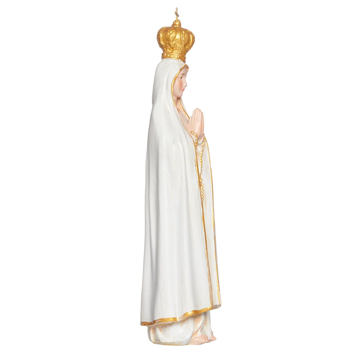 Side view of Our Lady of Fatima religious statue with crown and gold trim