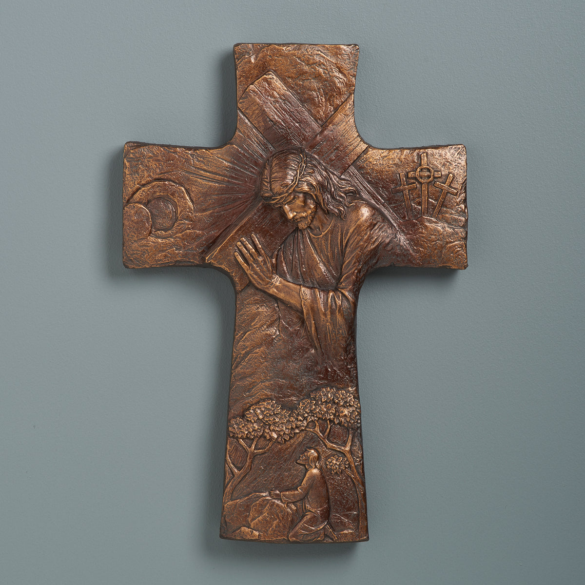 Joseph's Studio Christ Carrying the Cross Wall Cross displayed against a gray background showing the full relief design and dark bronze finish