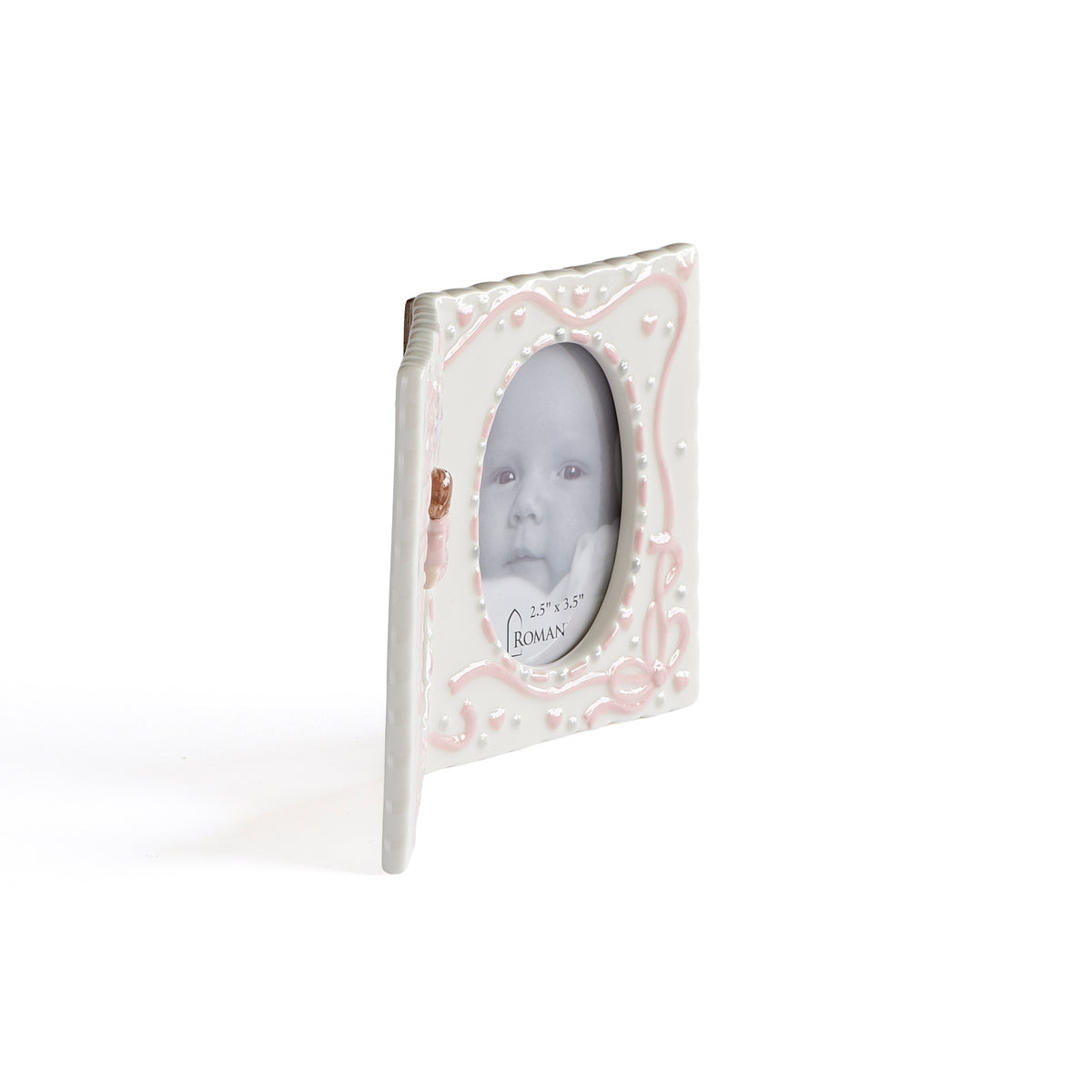 Side view of pink Hanging Cross & Praying Child Keepsake Picture Frame showing the folding keepsake frame design