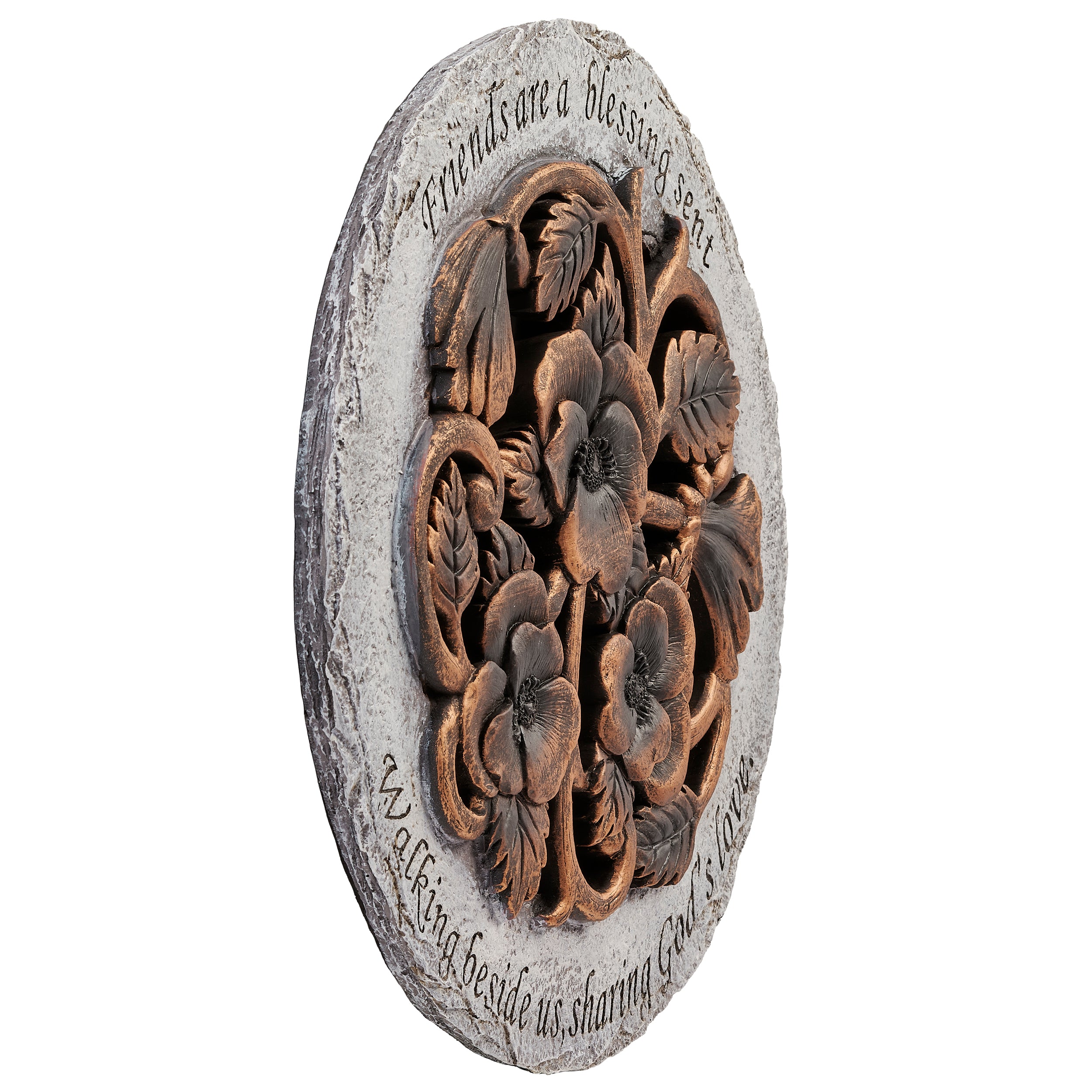 Decorative stone with floral carvings and engraved text on a white background