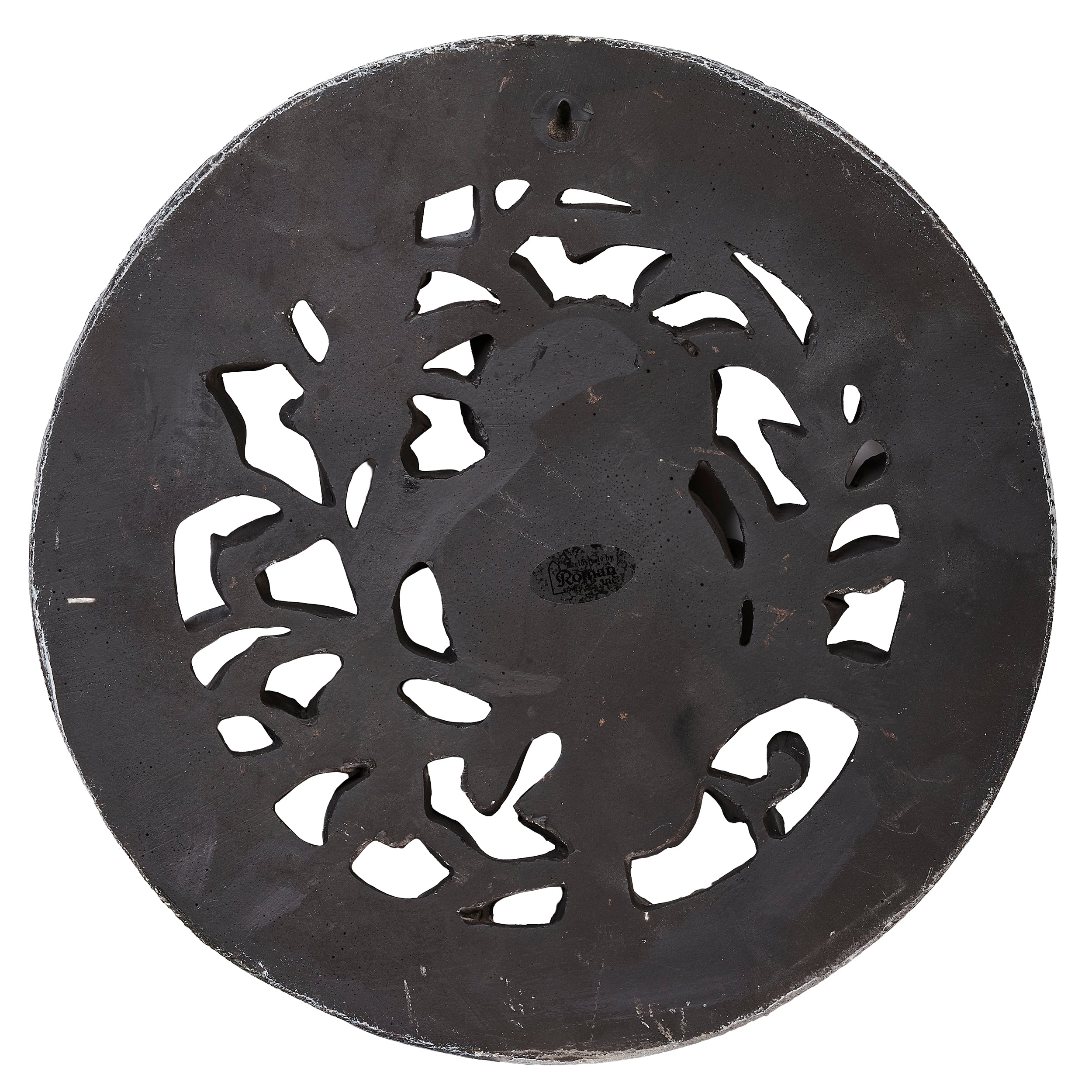 decorative disc with cut-out patterns on a white background