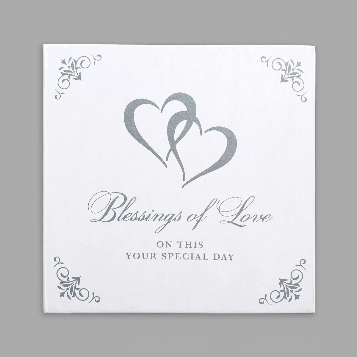 Closed white gift packaging with intertwined hearts, silver floral corners, and “Blessings of Love” lettering.