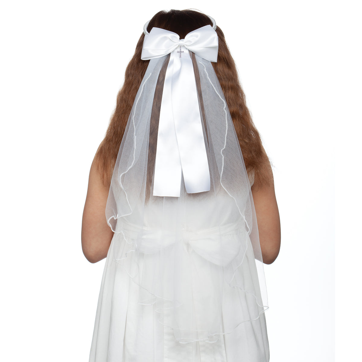 Olivia First Communion veil featuring a wide white satin bow, rhinestone headband, and layered white tulle veil worn with a Communion dress