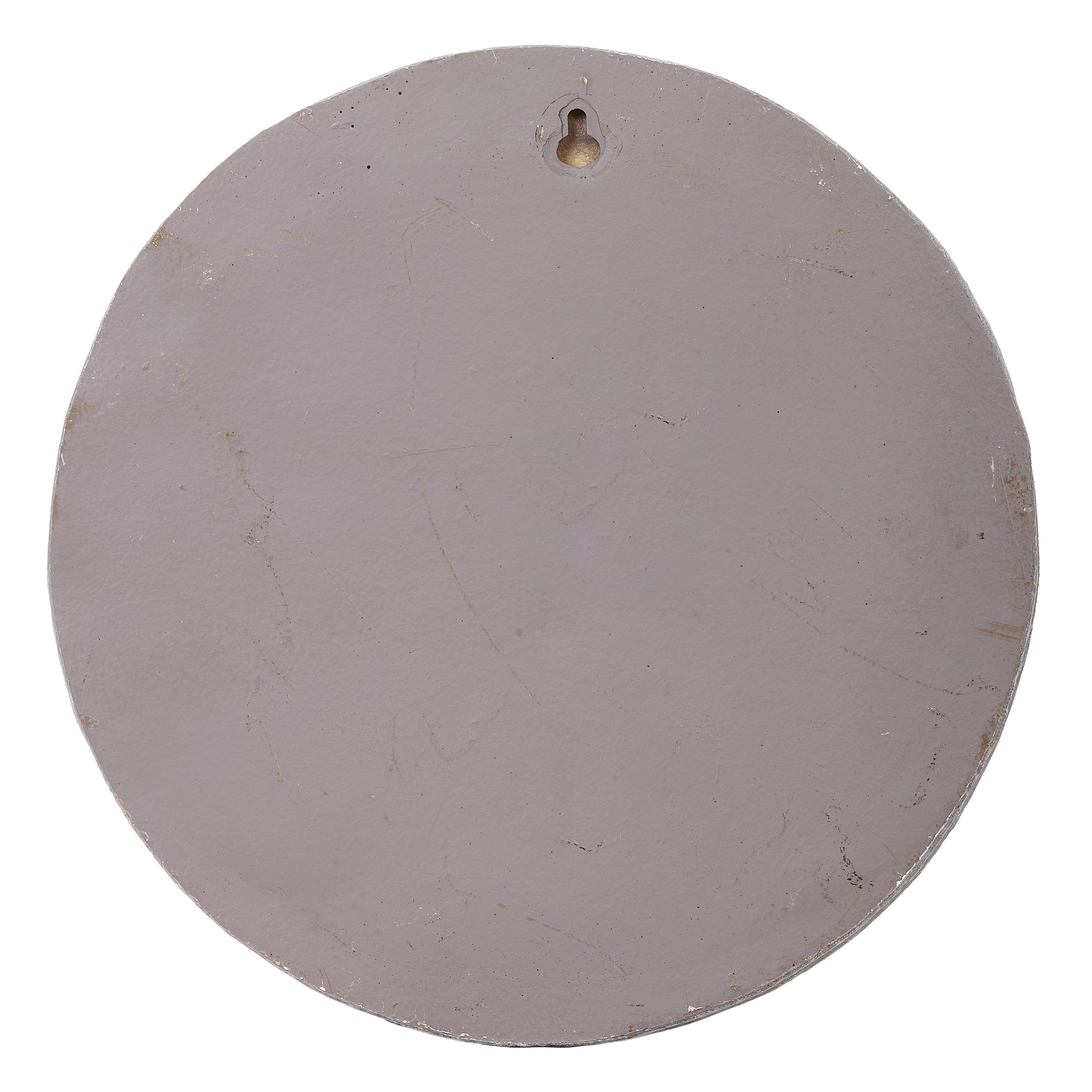Round gray object with a small hole on a white background