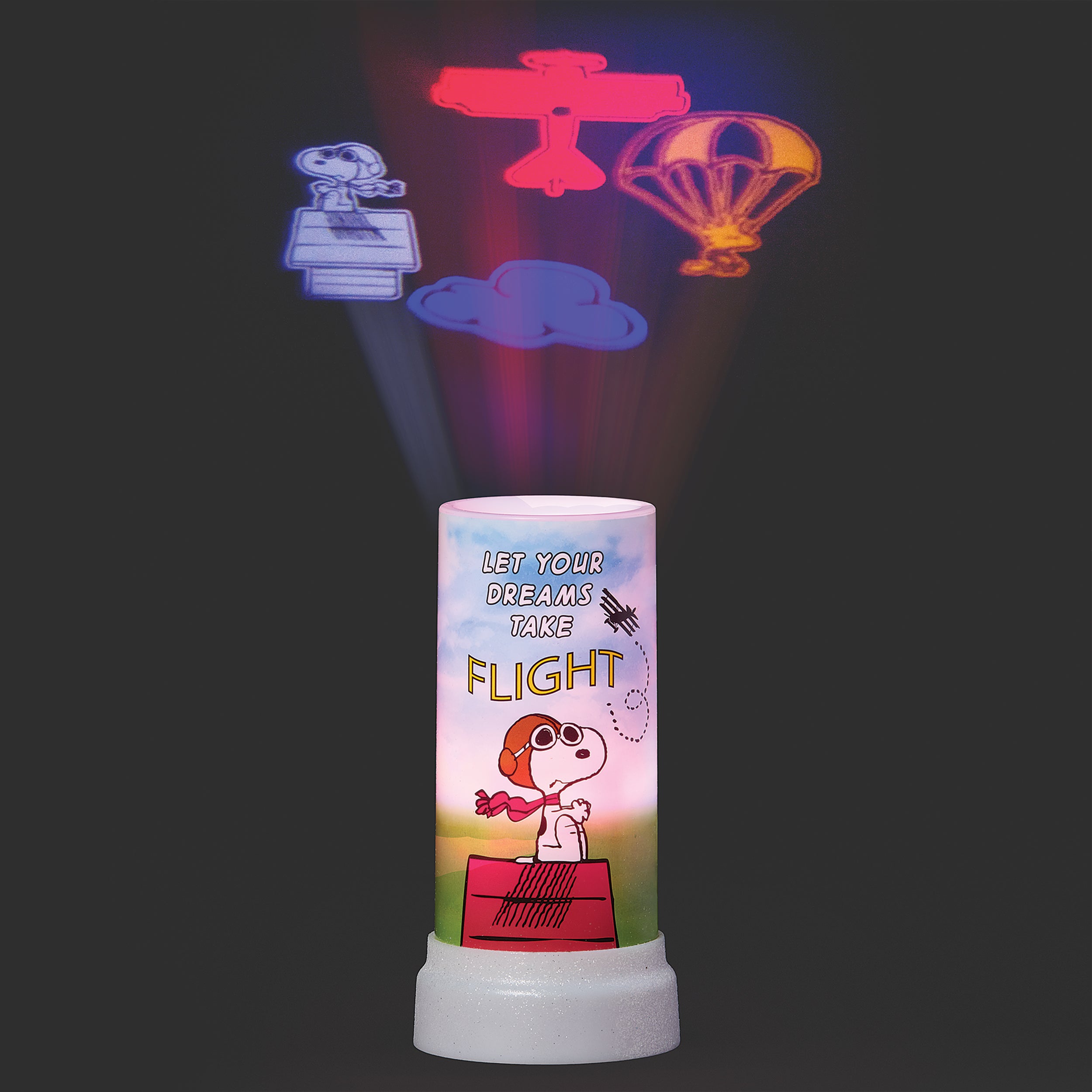 Projector with Snoopy illustration and flight-themed projections on a dark background