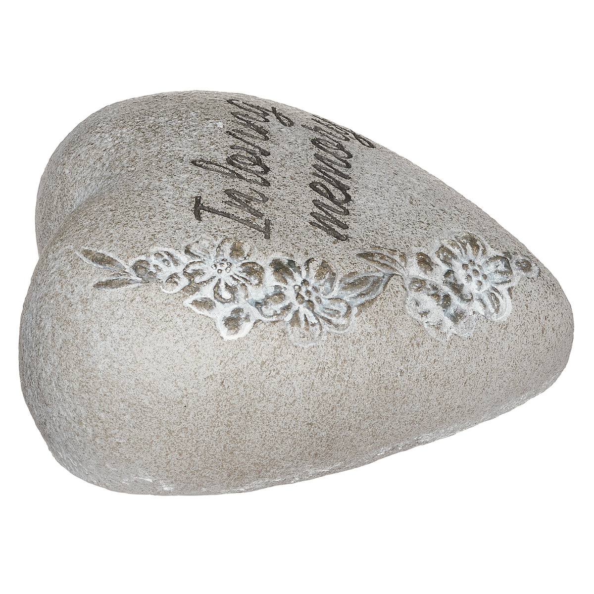 Low angled view of In Loving Memory heart-shaped garden stone showing the floral engraving and rounded profile