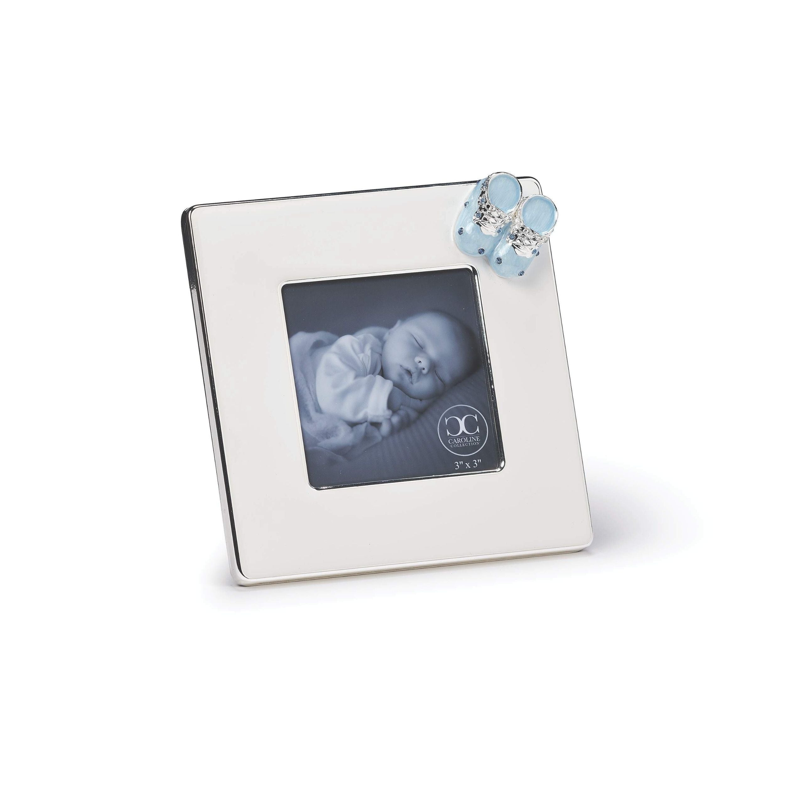 Silver picture frame with a blue baby shoe  on a white background