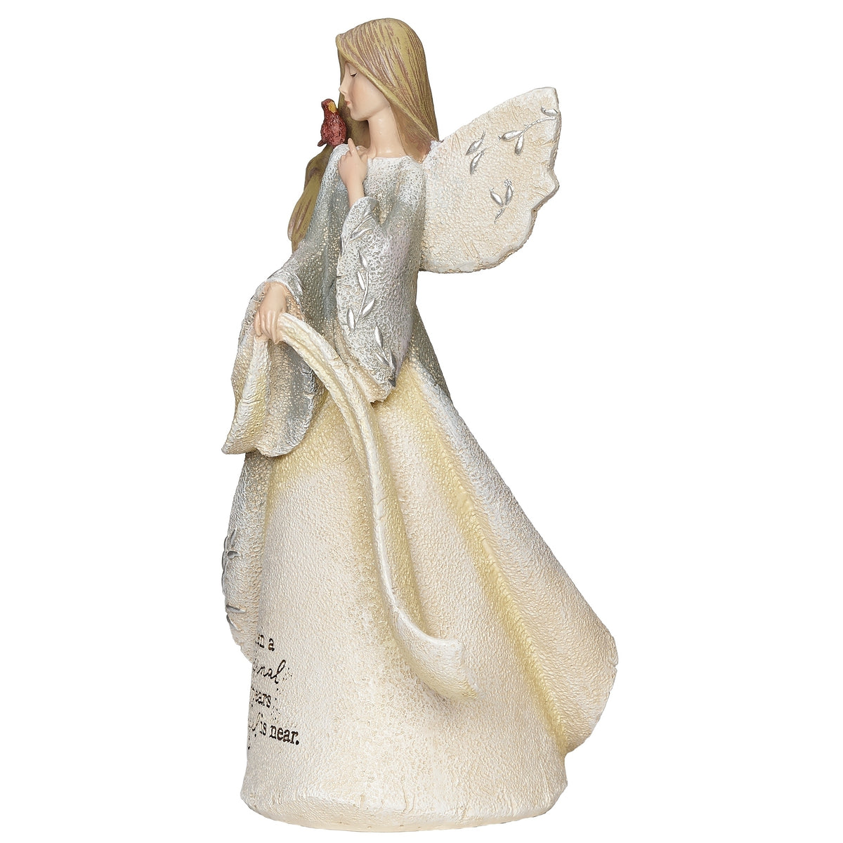 Opposite side view of memorial angel showing her raised wing and flowing cream and gold-toned gown.