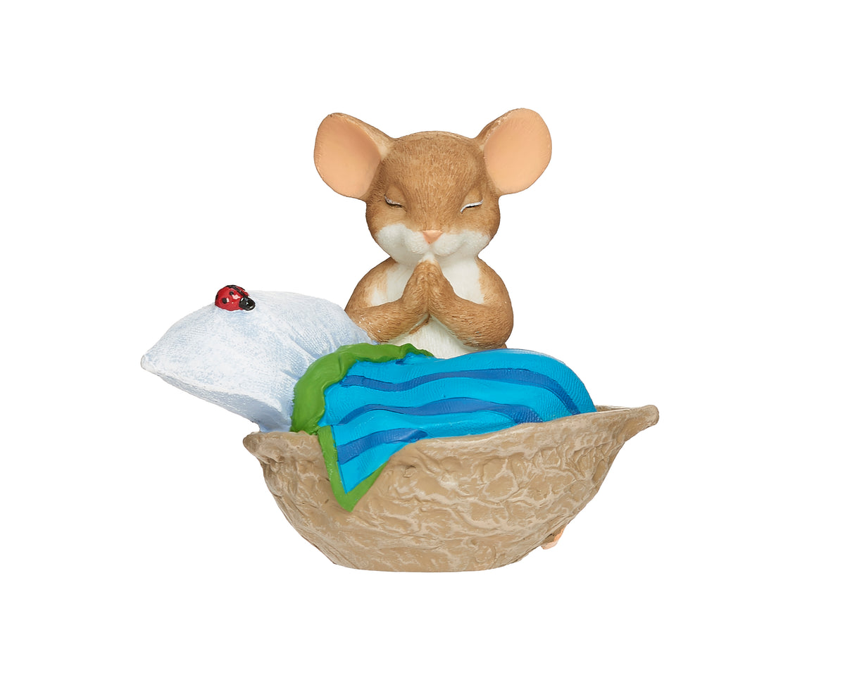 Front angled view of Charming Tails Bedtime Prayers figure showing the mouse beside the walnut shell bed and blue blanket