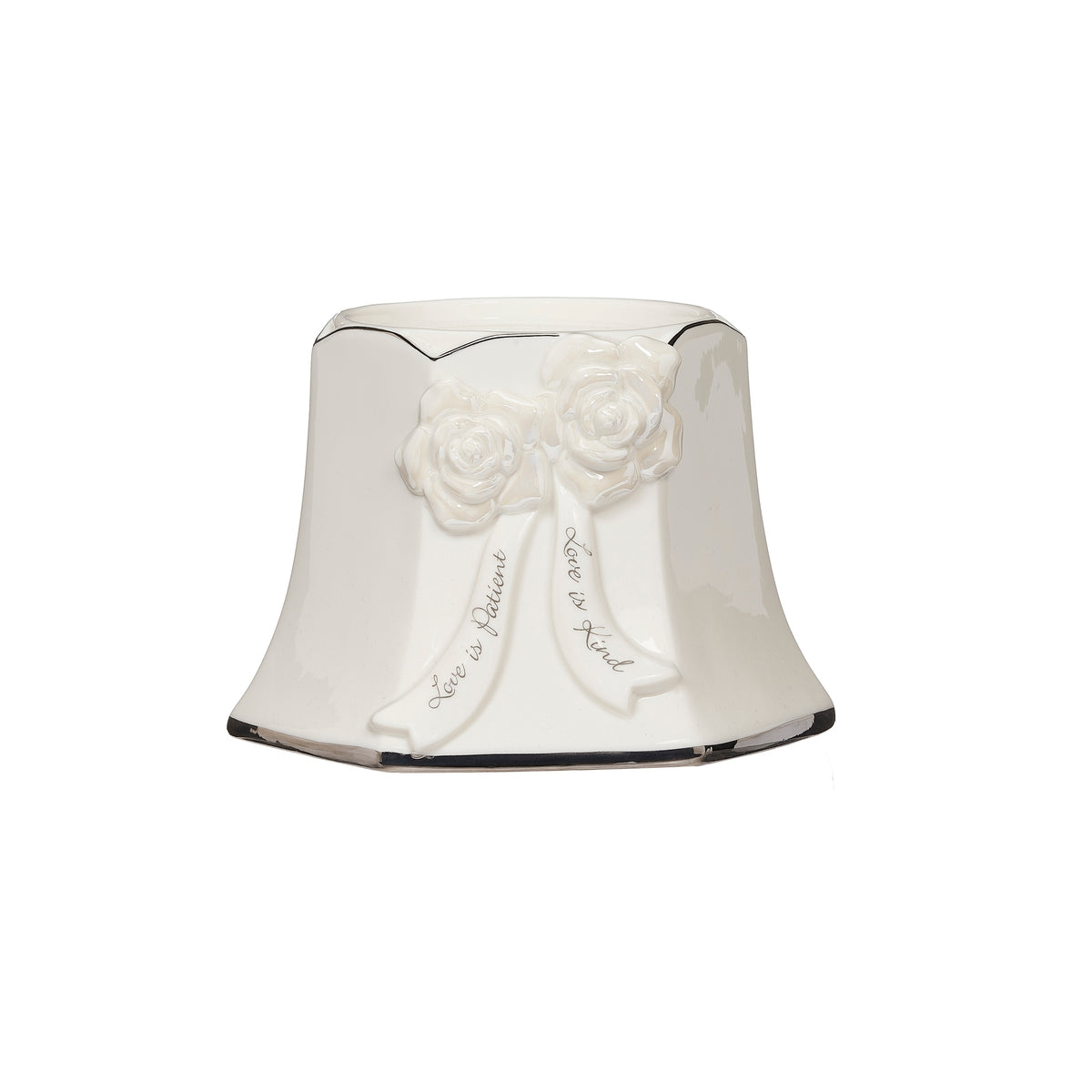 Front view of the center pillar candle holder showing raised flowers, flowing ribbons, and a scalloped rim.