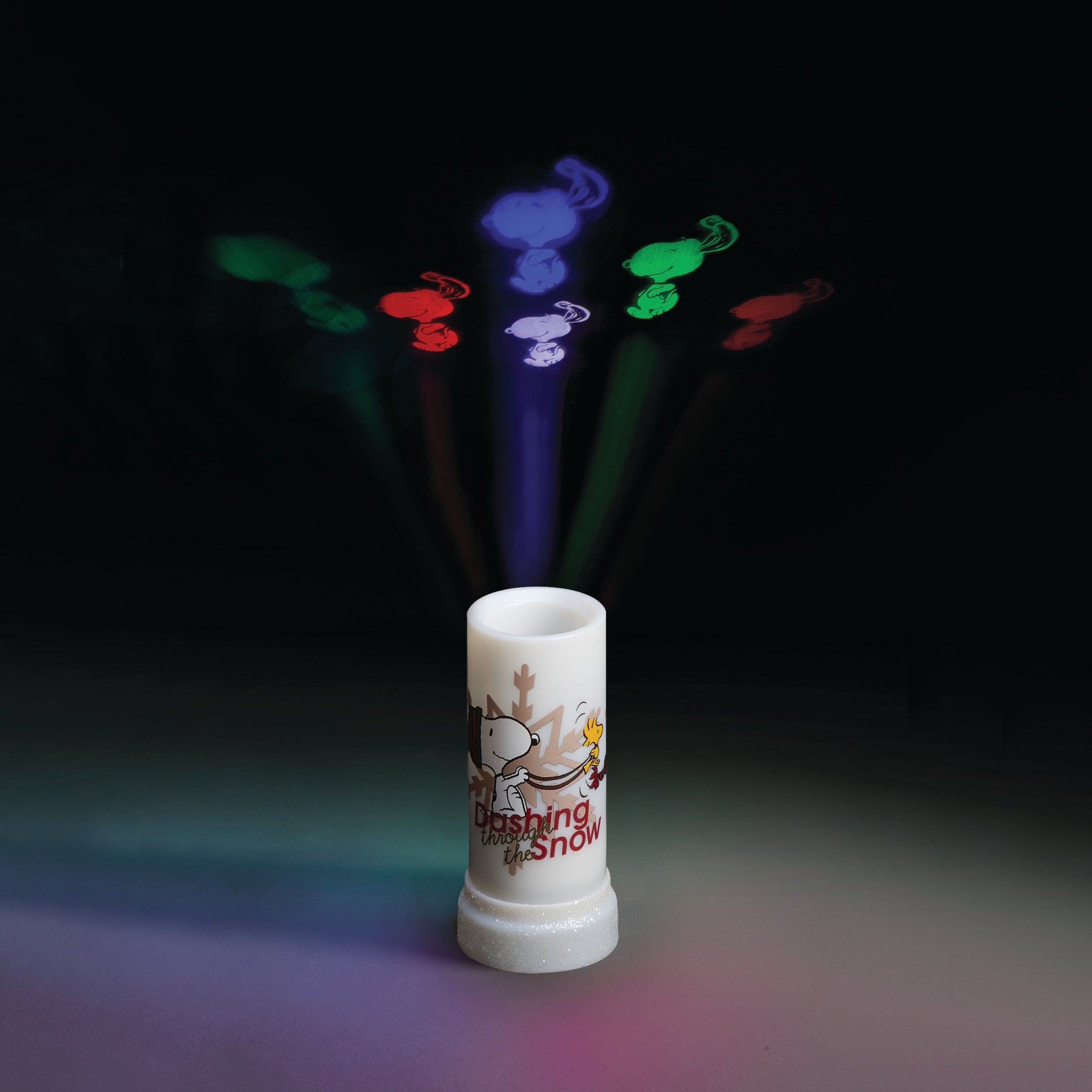 White cylindrical device with colorful light projections on a dark background