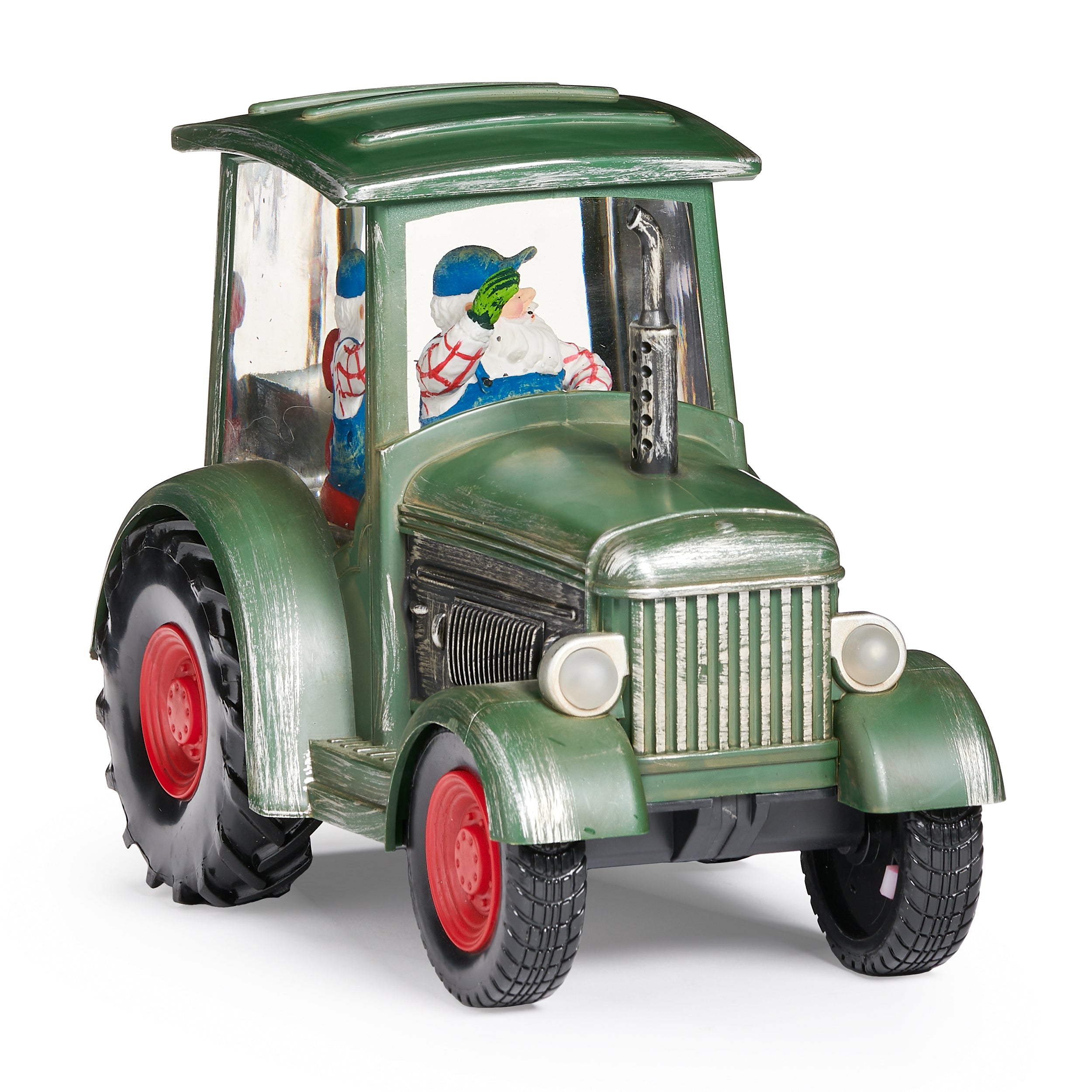 Model of a green tractor with a transparent body showing a Santa Claus figure inside, on a white background.