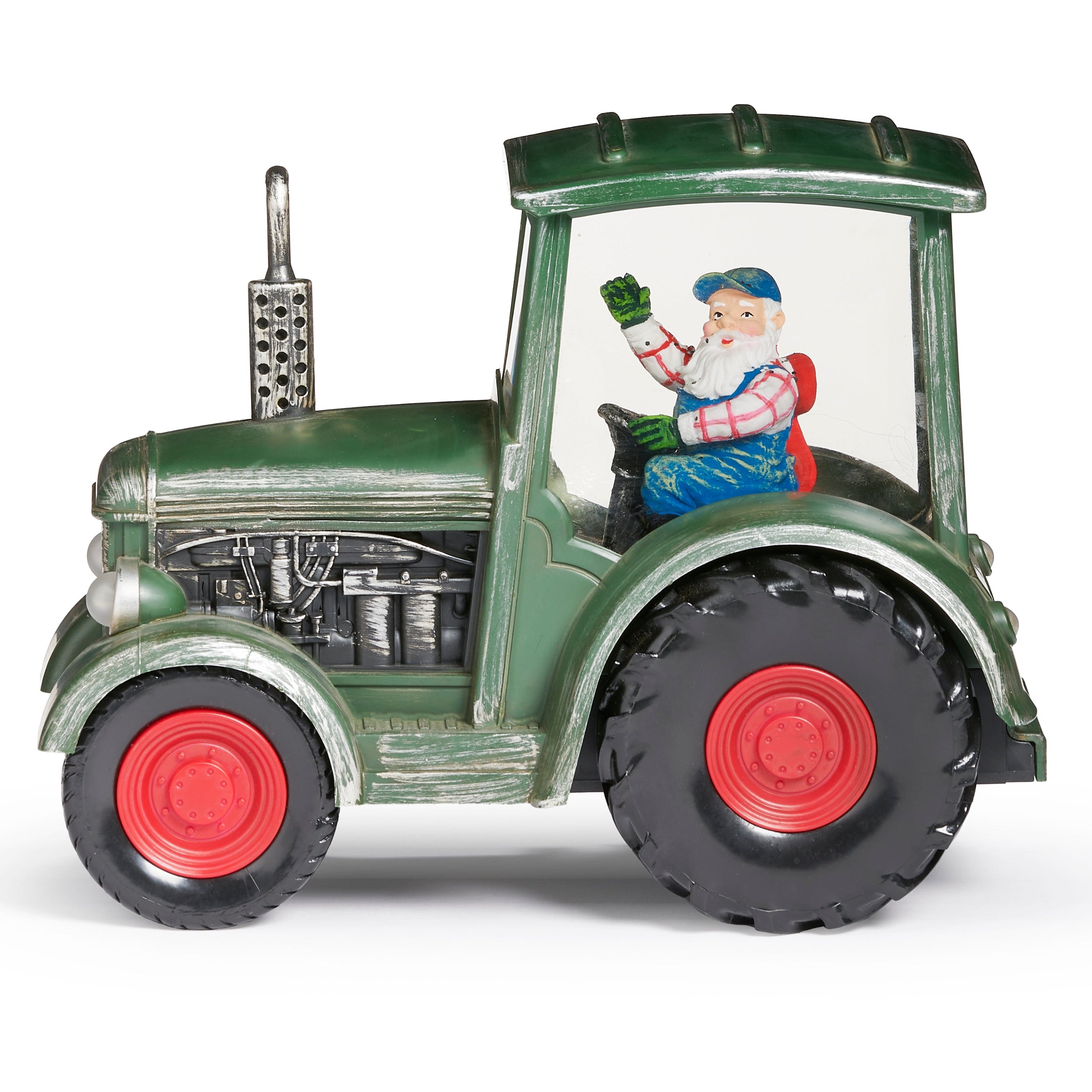 Model of a green tractor with a transparent body showing a Santa Claus figure inside, on a white background.