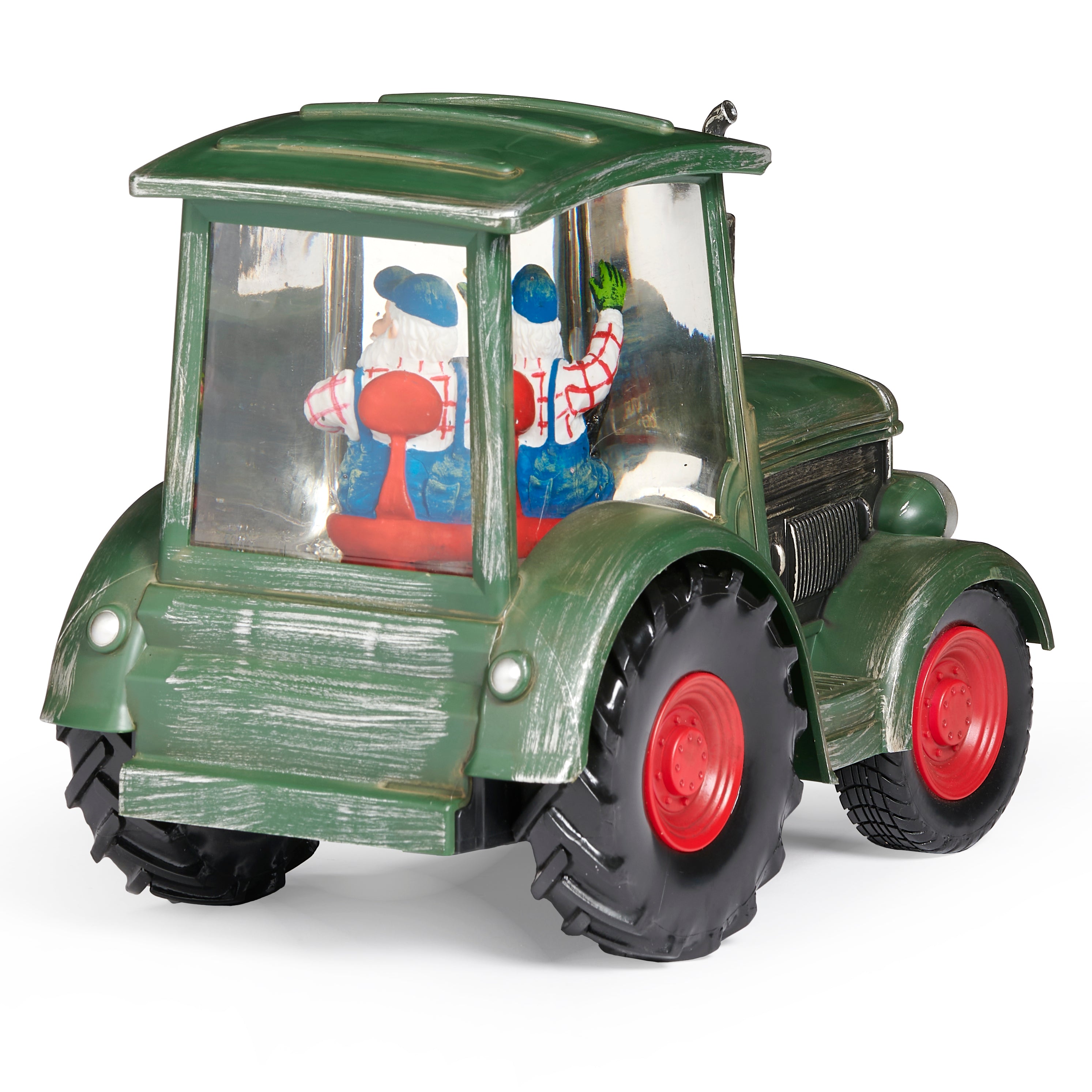 Model of a green tractor with a transparent body showing a Santa Claus figure inside, on a white background.