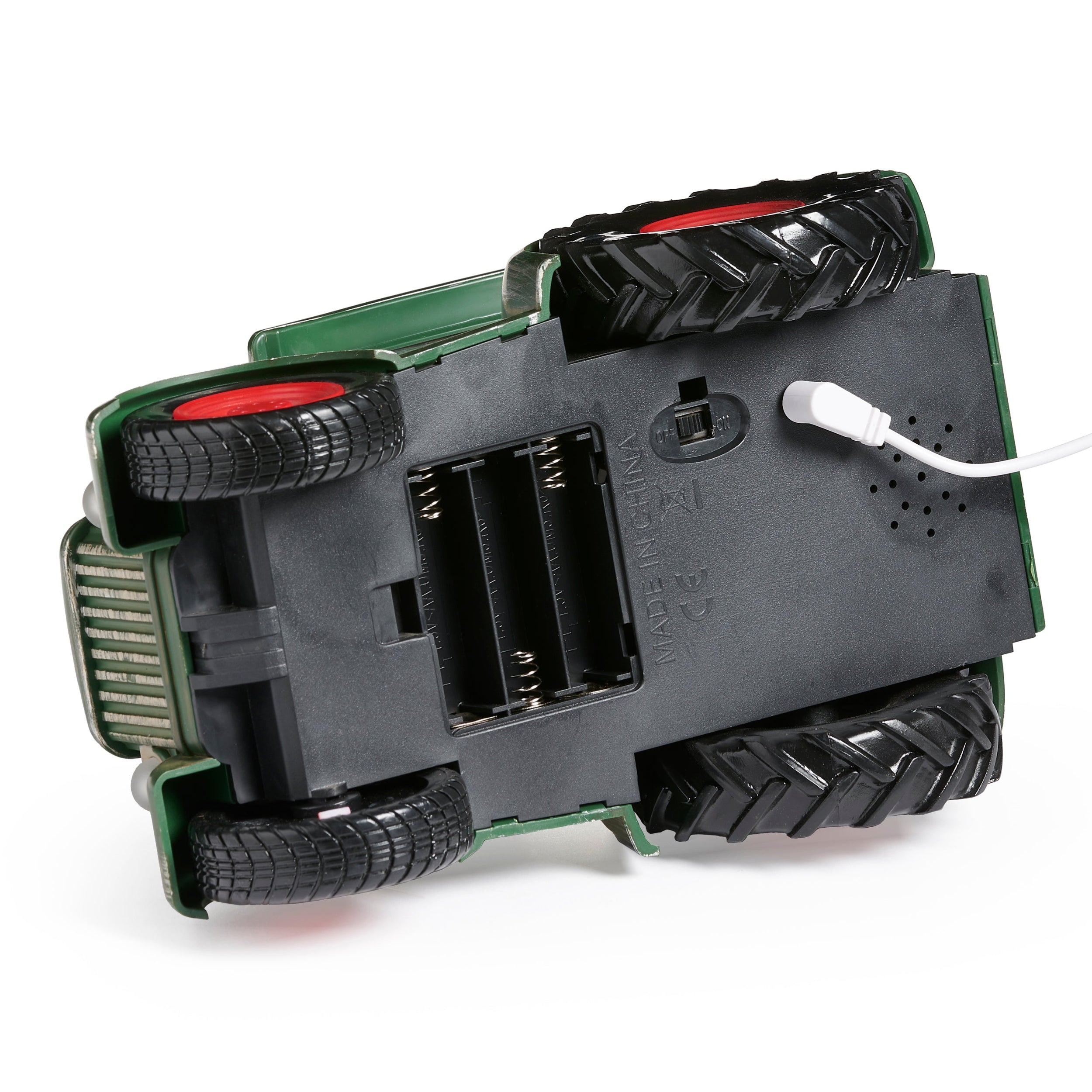 Photo showing underneath tractor with battery compartment on white background