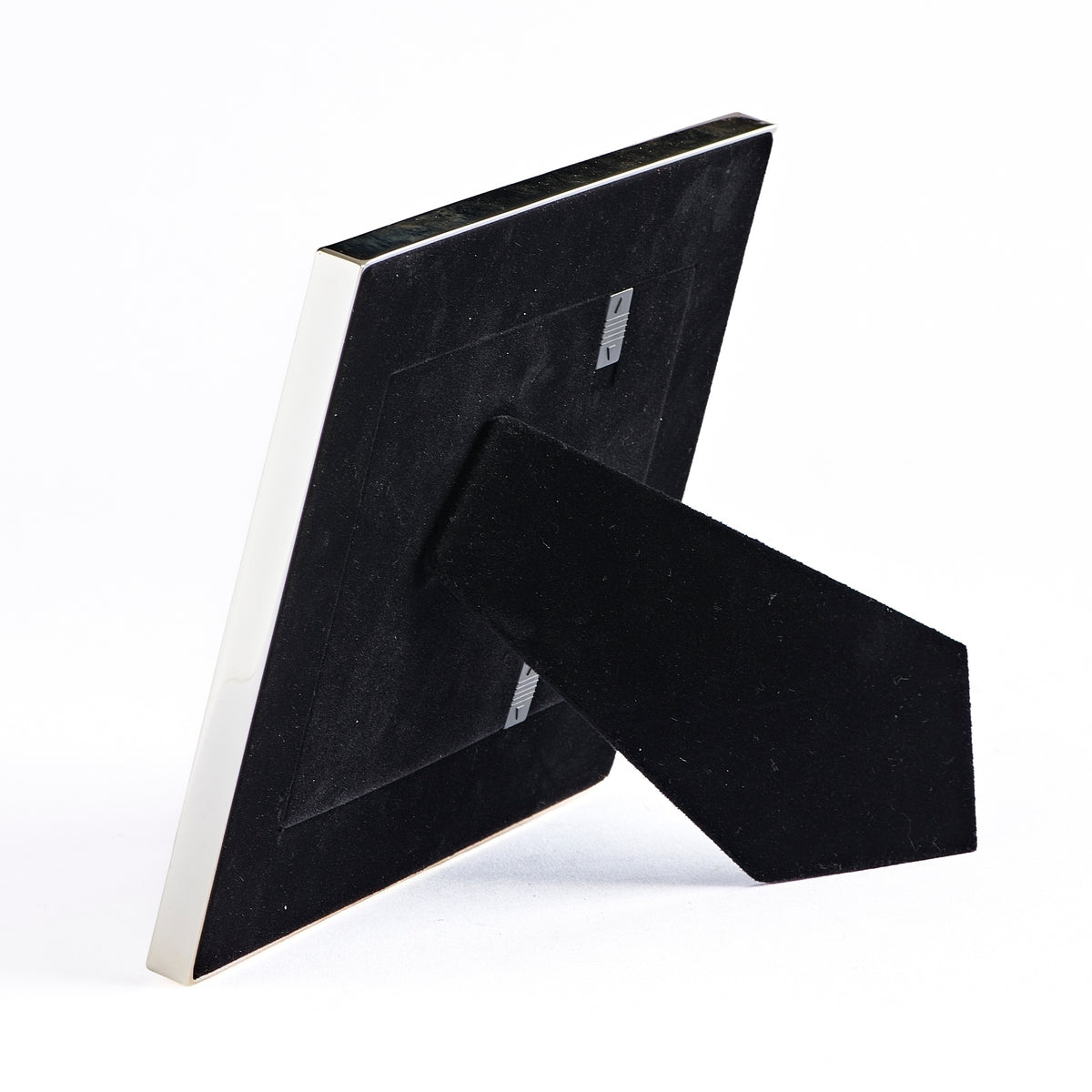 Rear angled view of Caroline Collection Silver Heart Picture Frame showing the black backing and tabletop easel stand