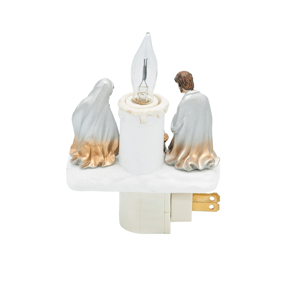 Rear view of Holy Family night-light showing the backs of Mary and Joseph, the white candle, and plug prongs extending to the side.