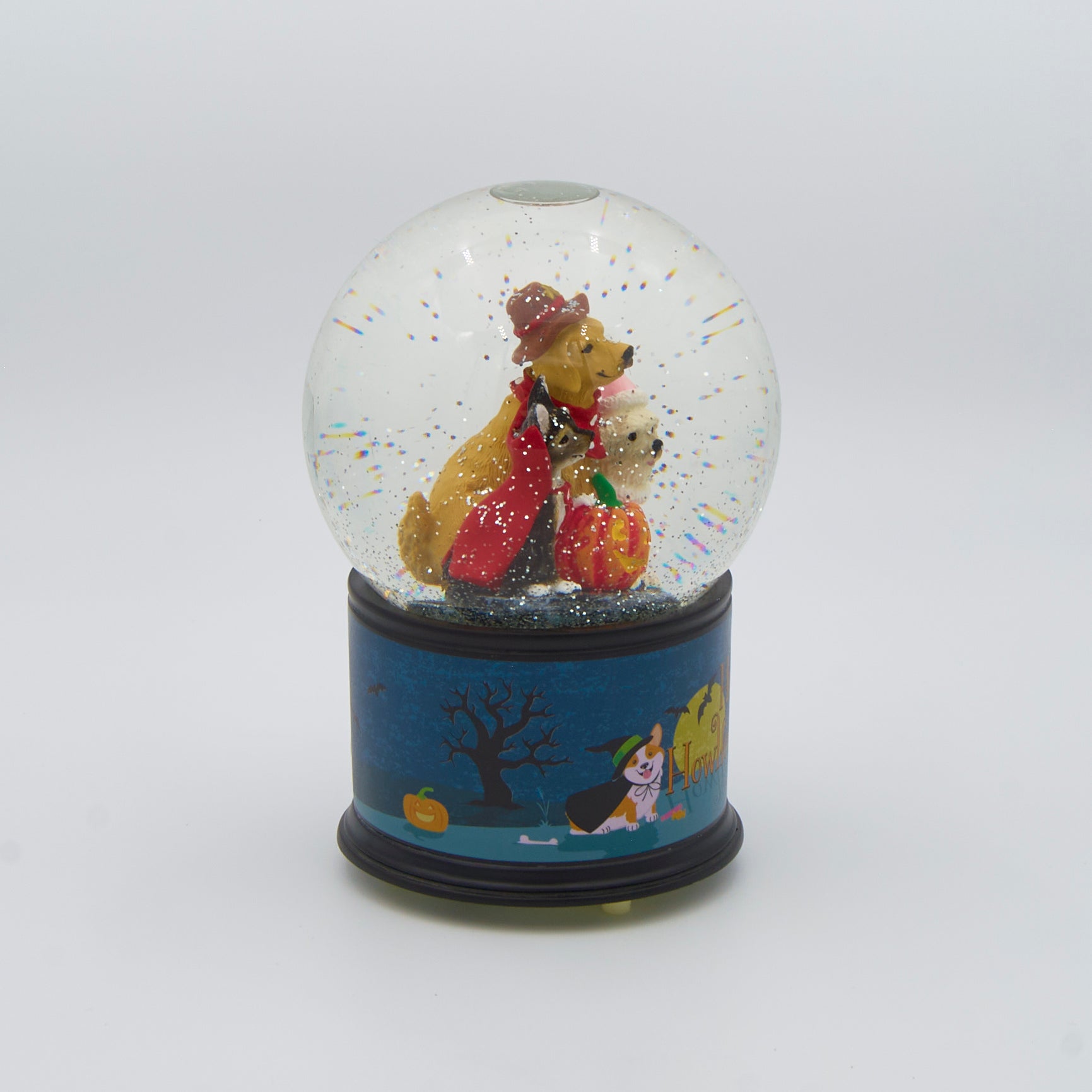 Halloween-themed glitterdome with three dogs wearing costumes inside