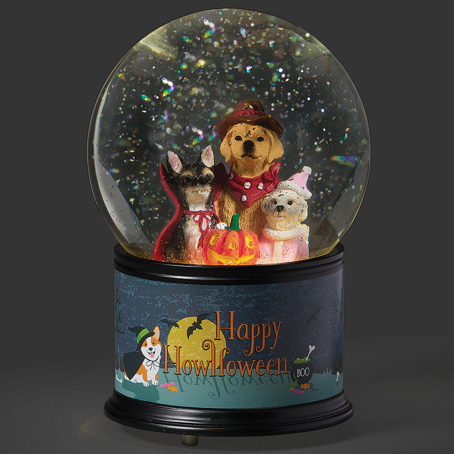 Halloween-themed glitterdome with three dogs wearing costumes inside