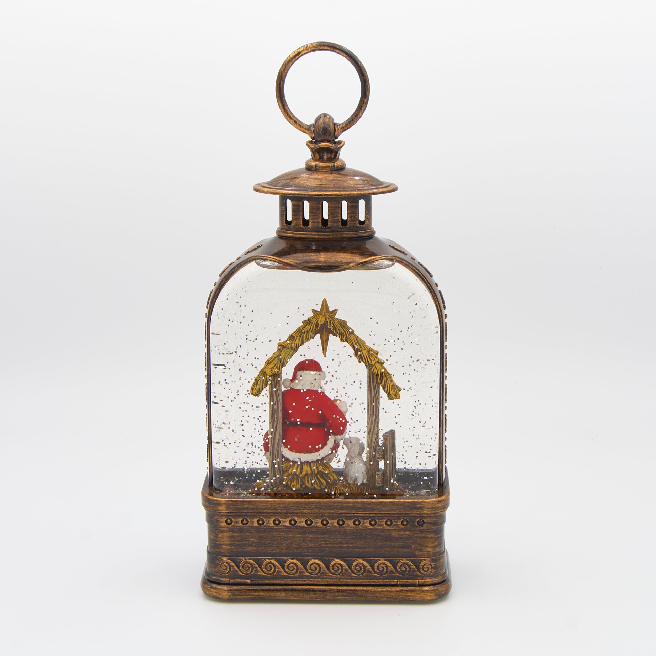 Decorative lantern with baby Jesus and Santa inside on a white background