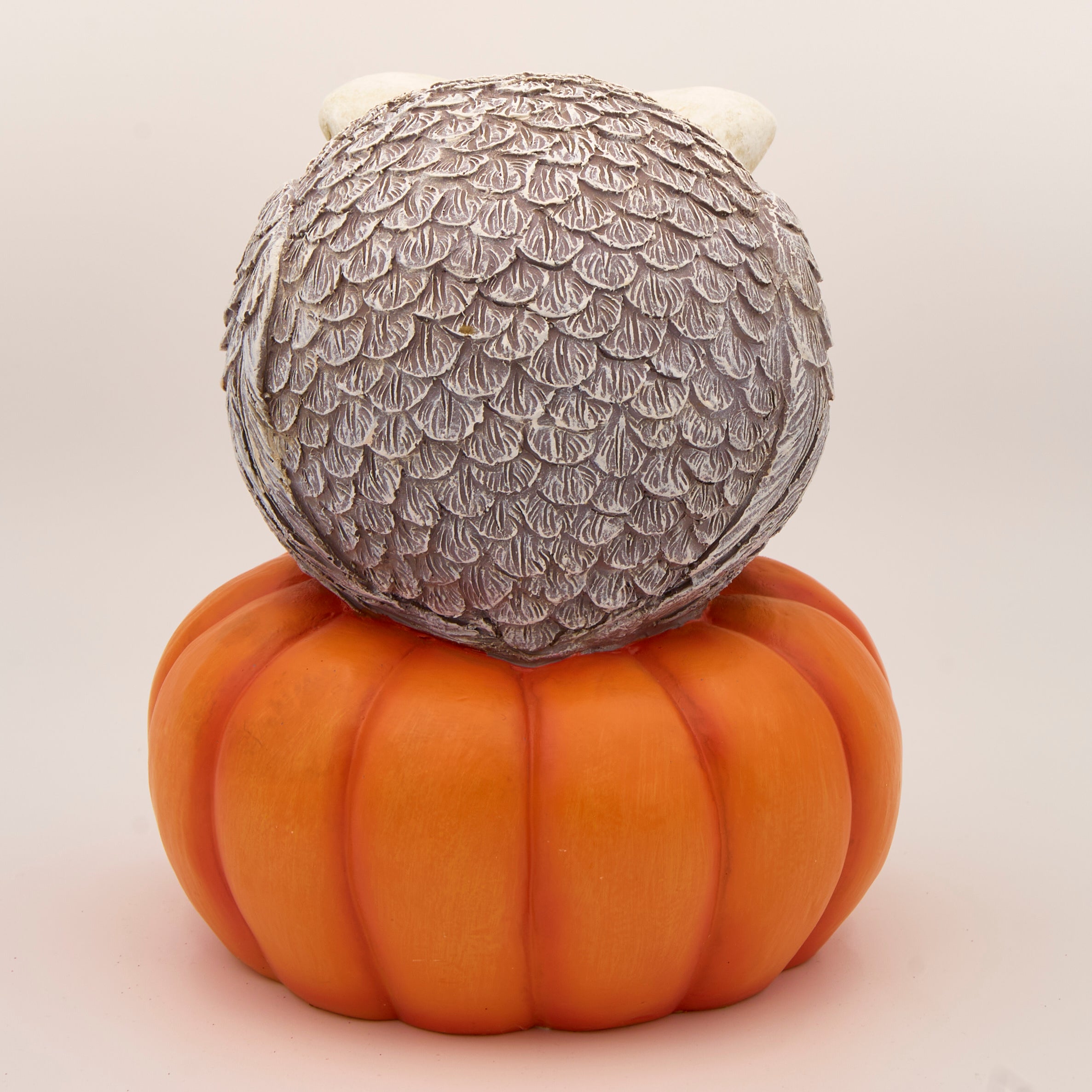 Decorative owl on a pumpkin