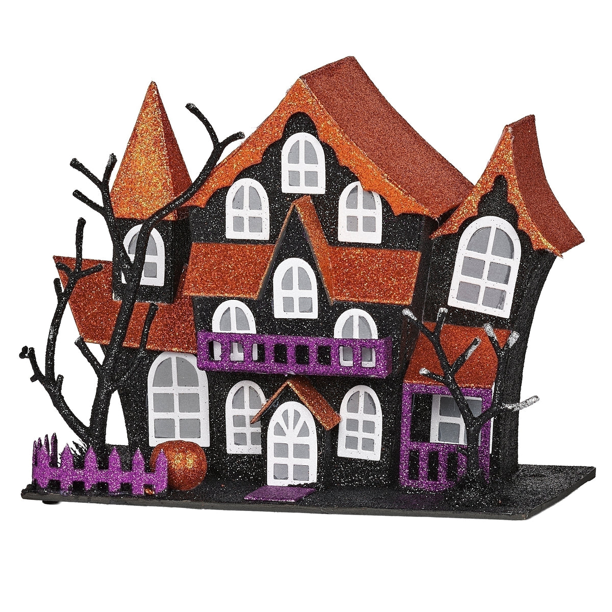 Front view of haunted mansion showing multiple peaked roofs, arched windows, and a purple balcony above the entrance.