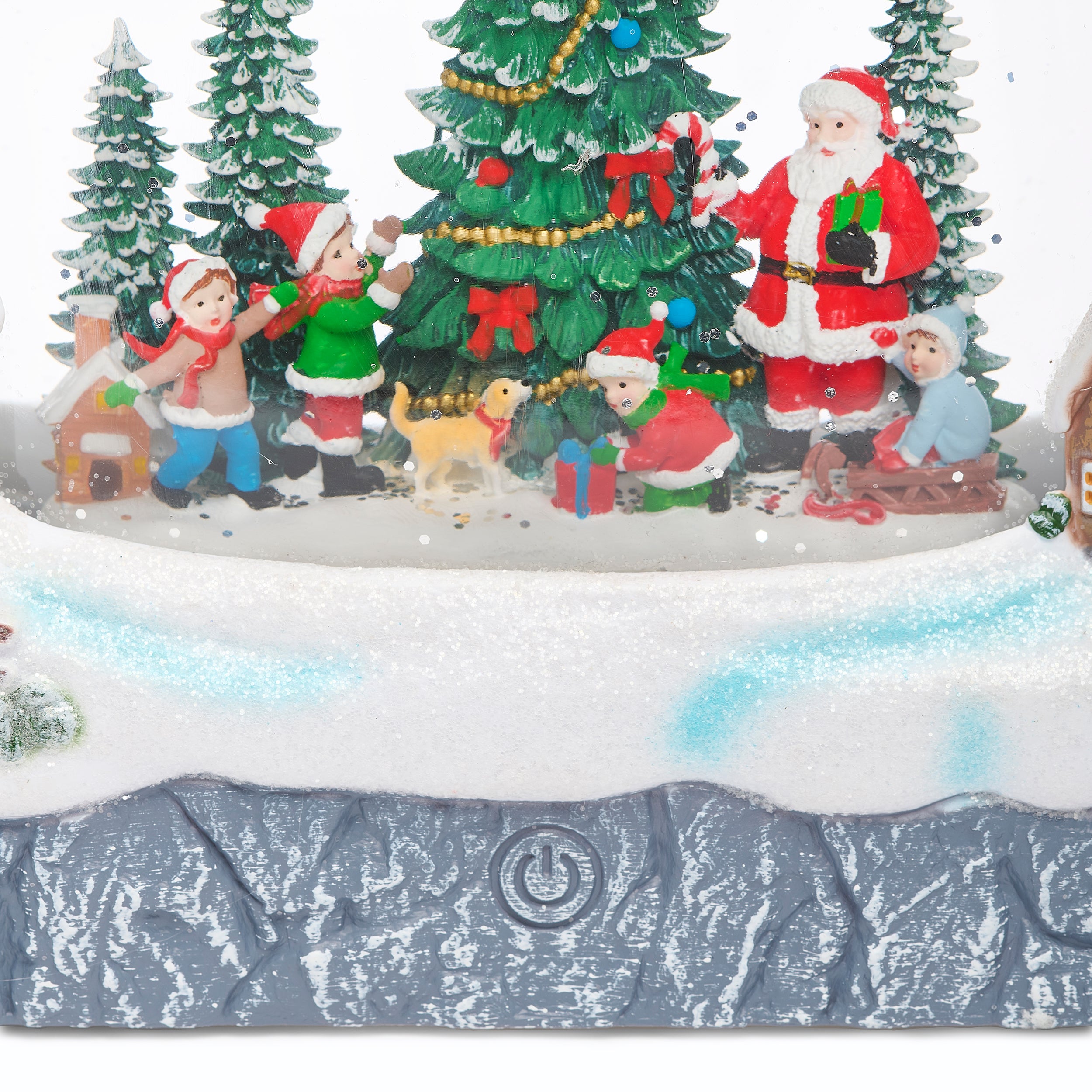 zoomed in view of Christmas scene and power button on a white background.