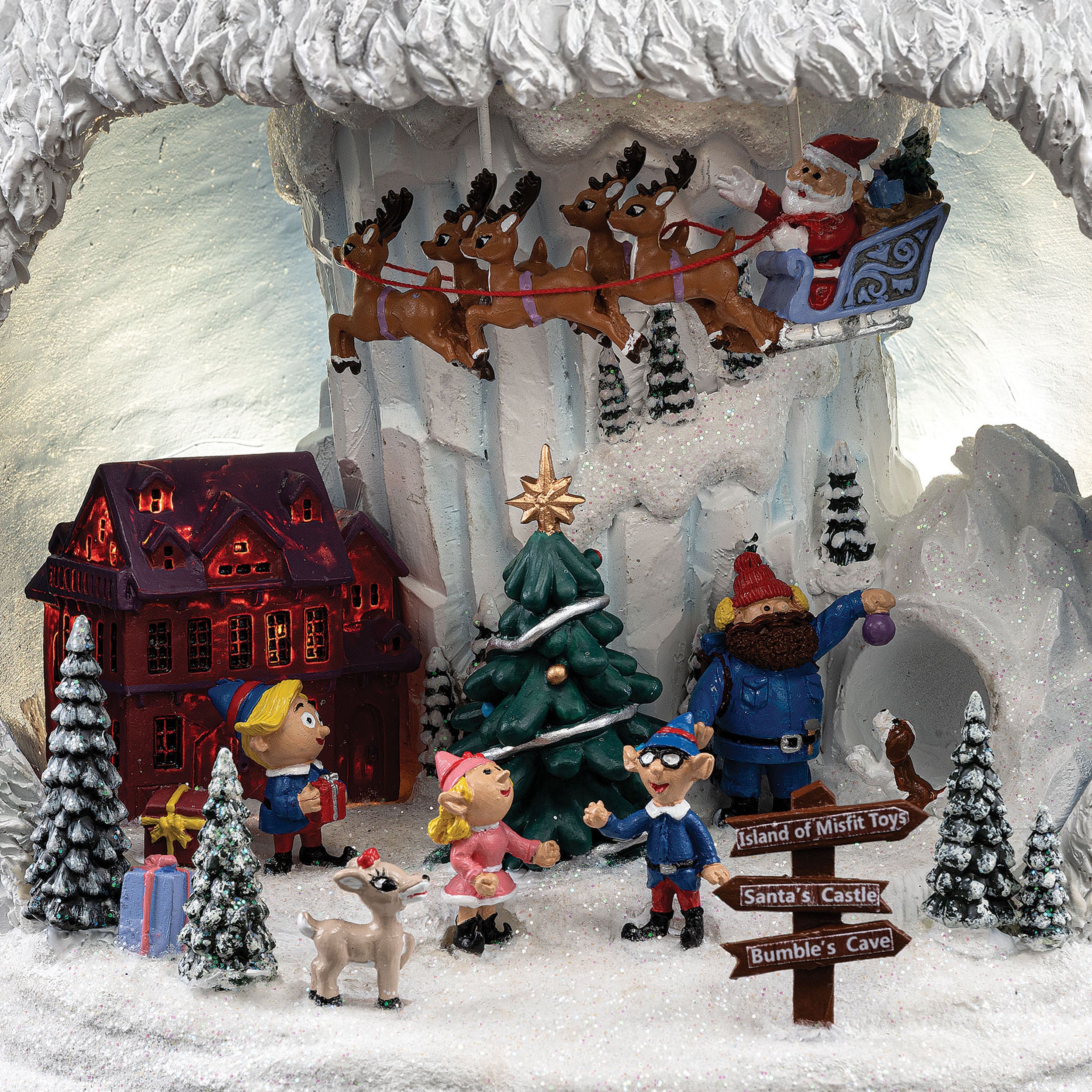 mini christmas scene with santa and elves