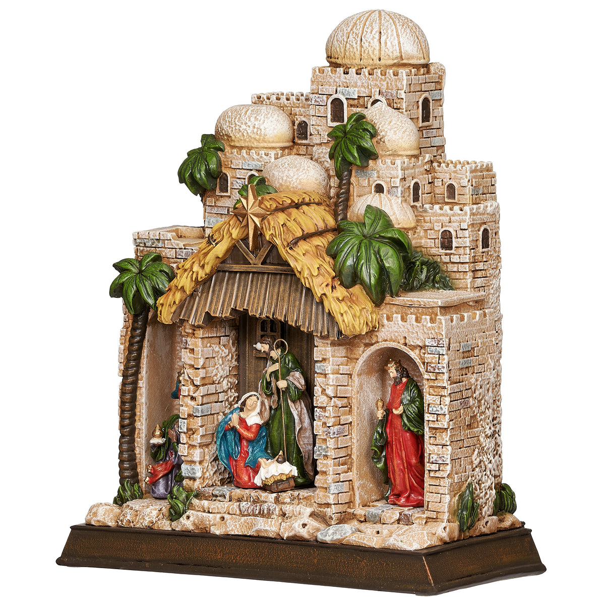 Front angled view: Front angled view of Lighted Nativity in Town Scene showing the Holy Family, rustic stable, detailed village buildings, and palm tree accents