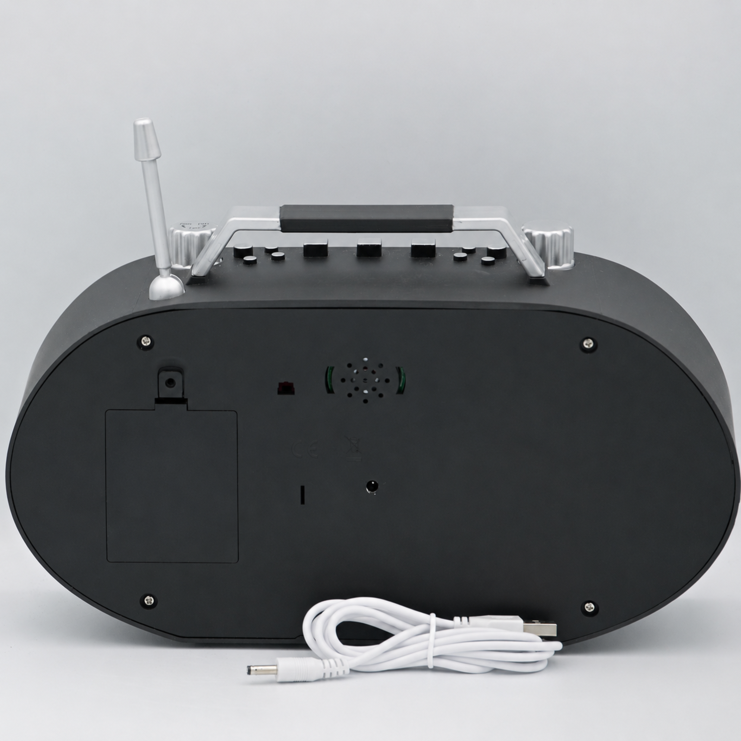 Black electronic device with antenna and power cable on a gray background