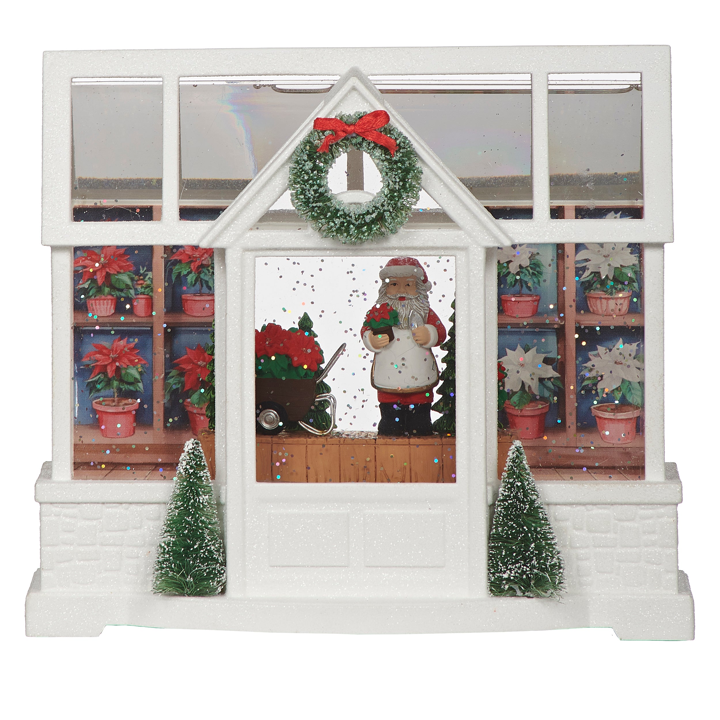 Christmas-themed window display with Santa Claus and potted plants, featuring a wreath on the door.