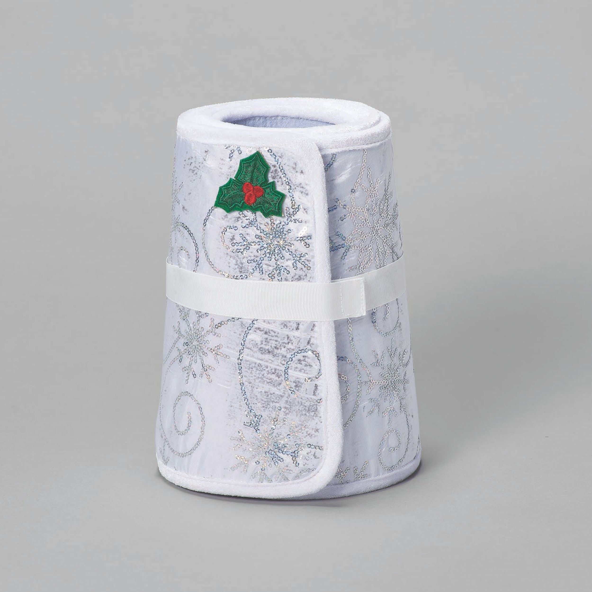 Roll of medical tape with a floral pattern on a gray background