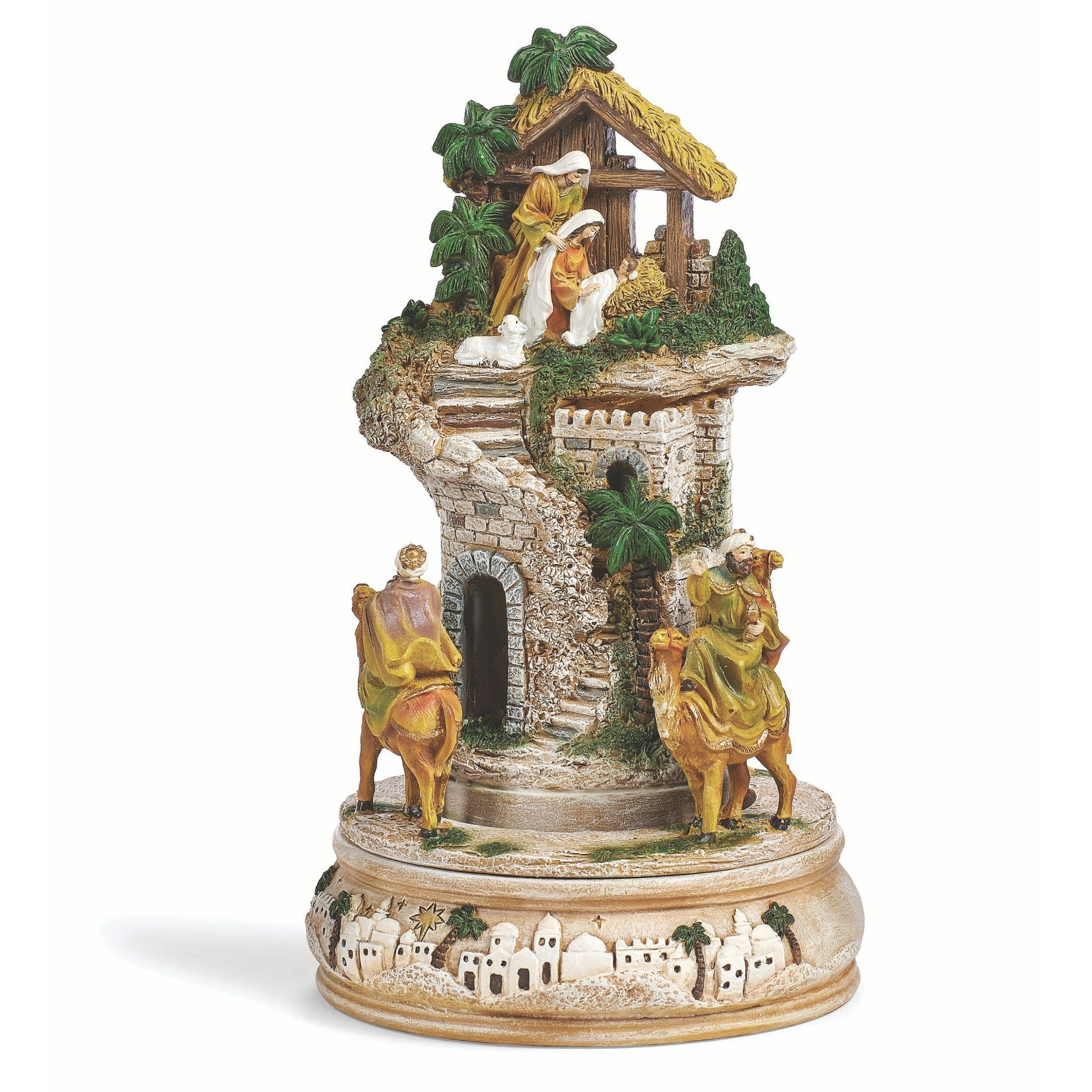 Decorative nativity scene figurine with stable and figures on a white background