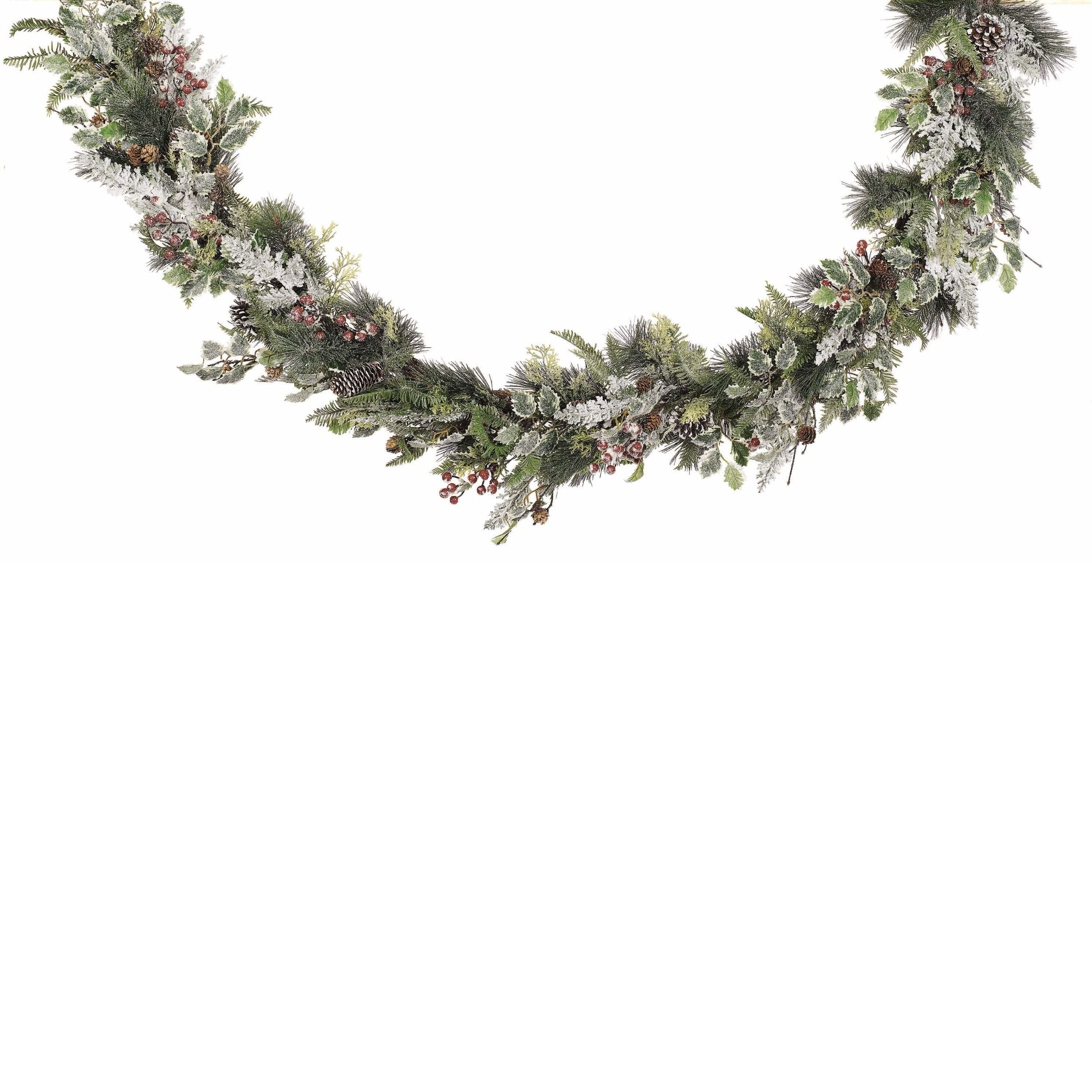 Decorative Christmas garland with greenery and berries on a white background