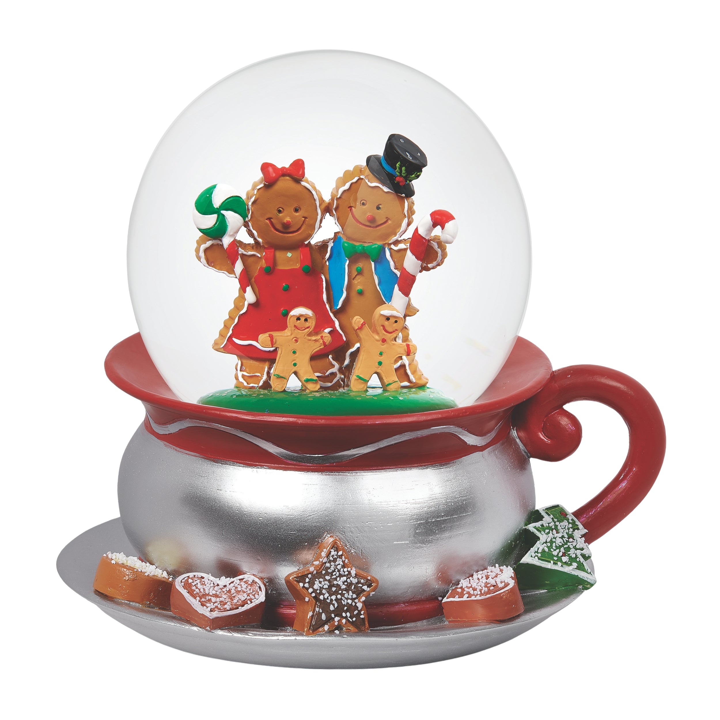 Gingerbread family snow globe inside a red teacup with cookies on a white background