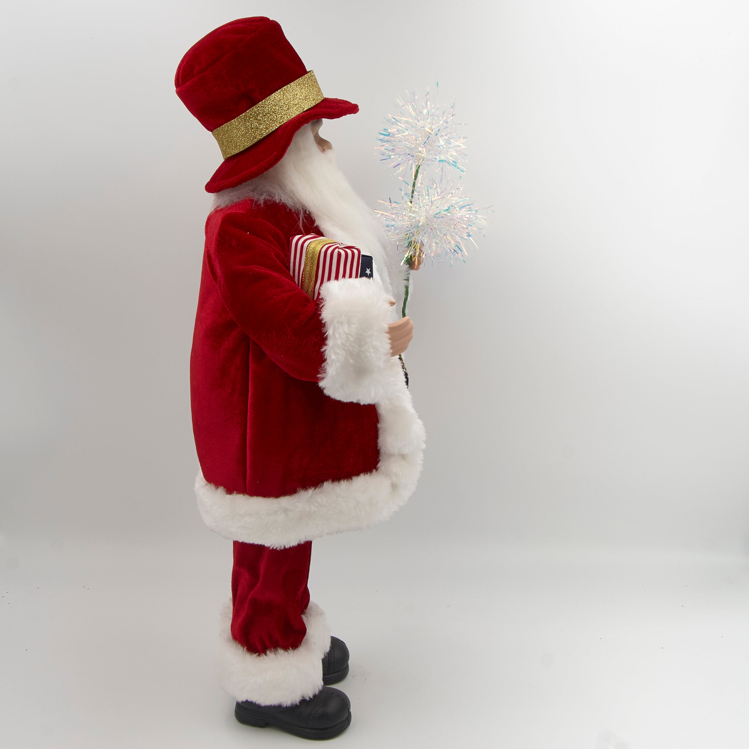 Traditional Santa Claus figure with American flag robe and sparklers on a white background