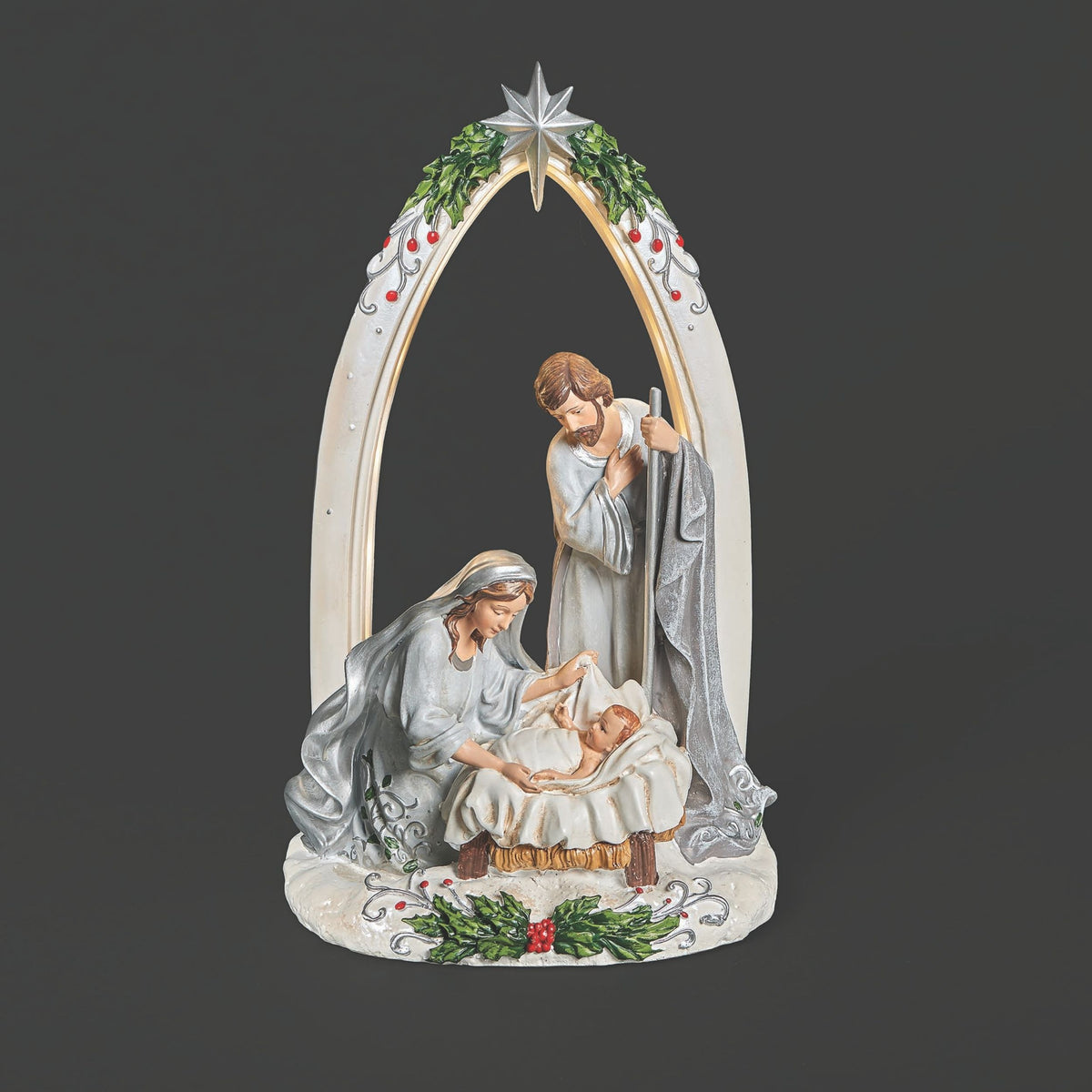 Nativity scene figurine with Mary, Joseph, and baby Jesus under a decorated arch on a black background.