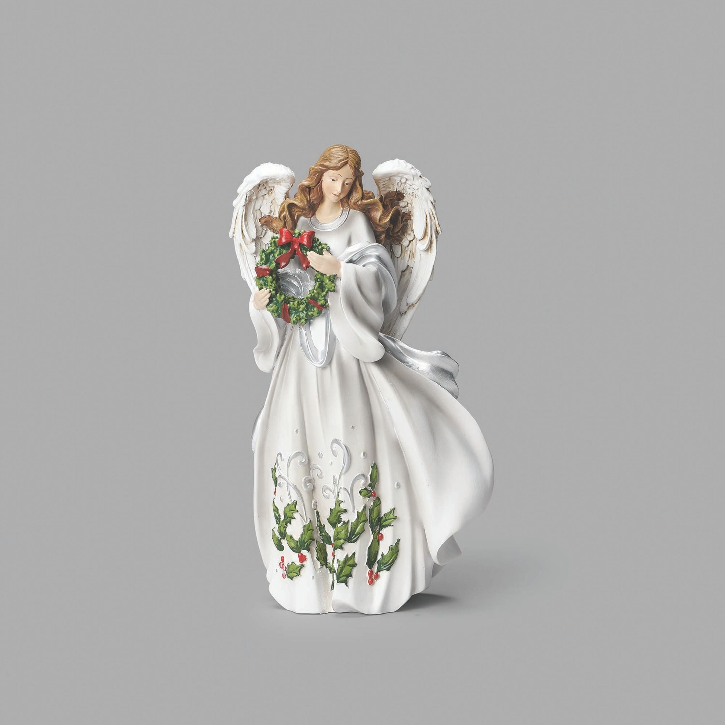 Decorative angel figurine holding a wreath on a gray background