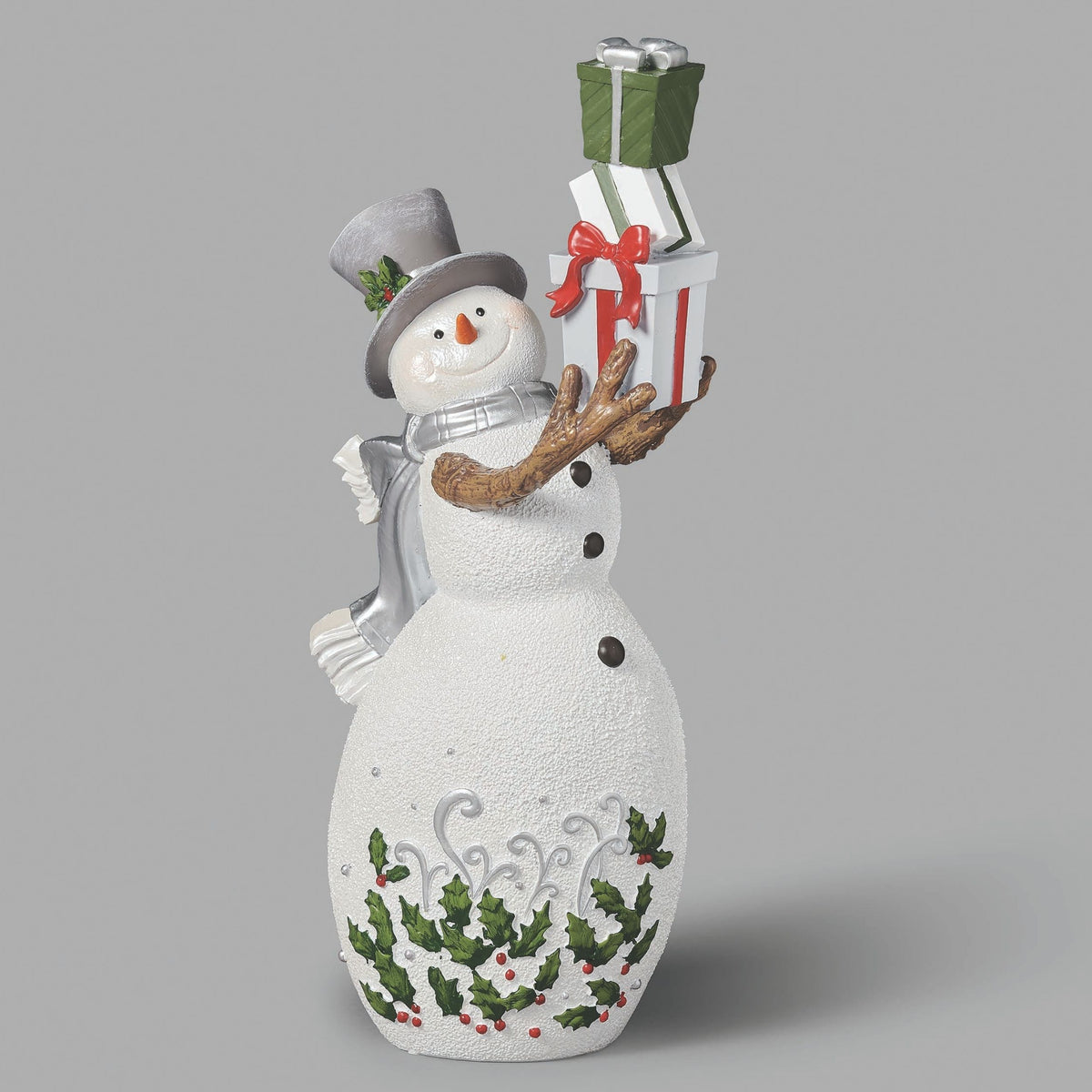 Decorative snowman figurine holding a gift on a light gray background