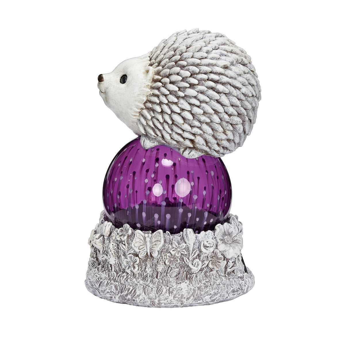 Side view of Pudgy Pals Solar-Powered Hedgehog Garden Statue showing the textured hedgehog, purple solar dome, and floral base