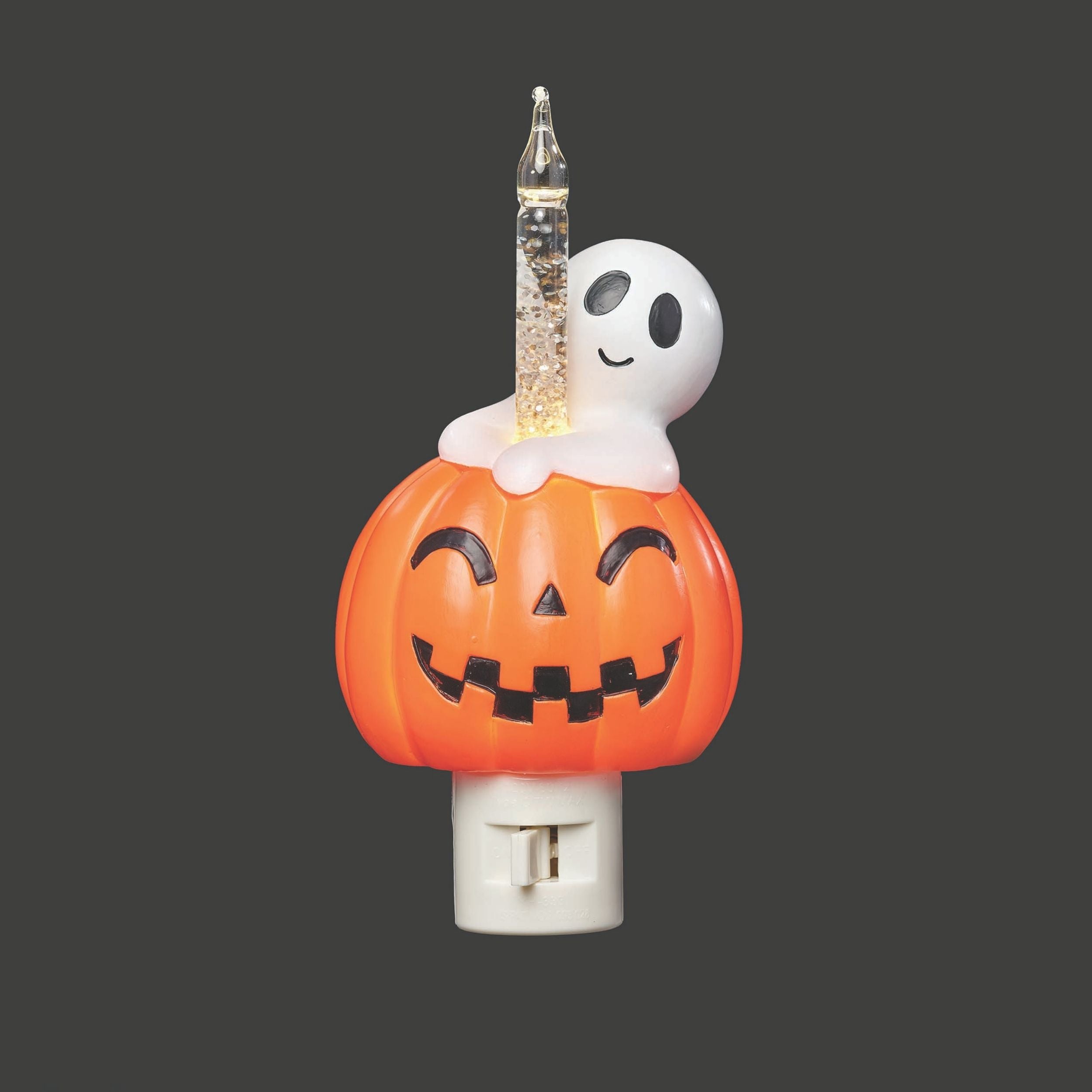 Halloween-themed night light with ghost and pumpkin design on a dark background